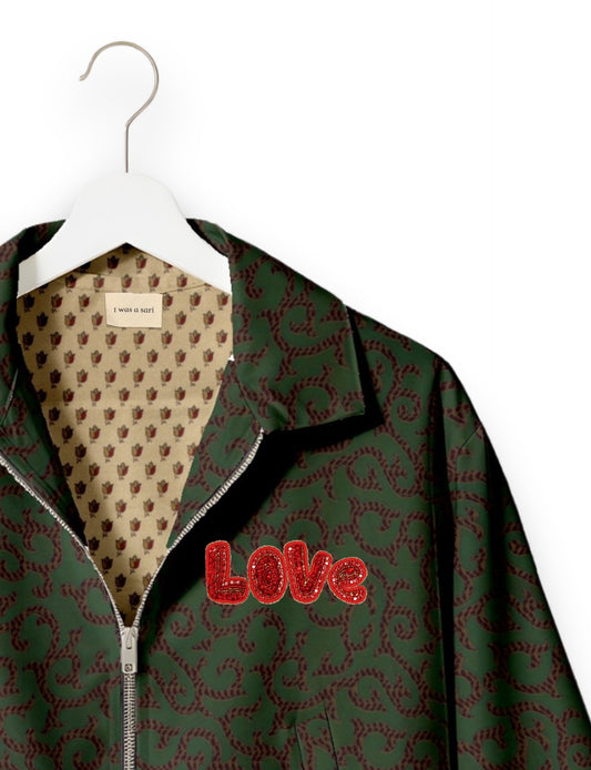 Love Bomber Jacket made from recycled fabric, featuring hand-stitched Aari embroidery. A unique piece of zero-waste clothing, part of the circular fashion movement. Designed with upcycled materials for a stylish yet environmentally friendly clothing choice.