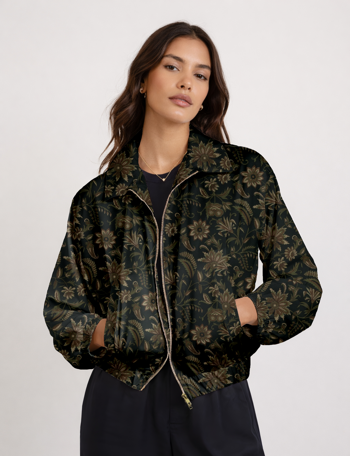 Women's cropped bomber jacket with twin metallic front zippers, welt pockets, elasticated hem and cuffs, and contrast sari print lining.