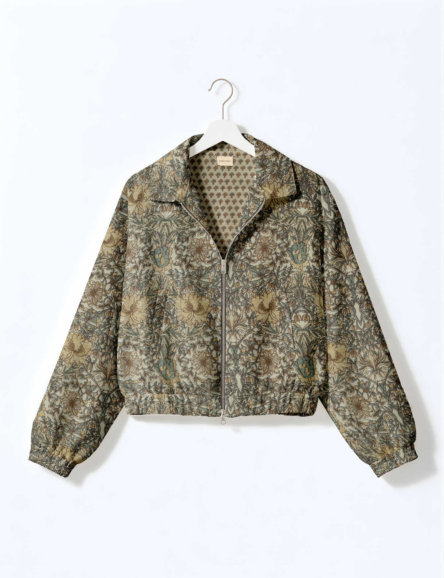 Upcycled Bomber Jacket made from recycled sari materials, featuring a cute cropped shape, elasticated hem and cuffs, and contrast sari print lining. Sustainable apparel promoting eco-friendly fashion and ethical clothing.