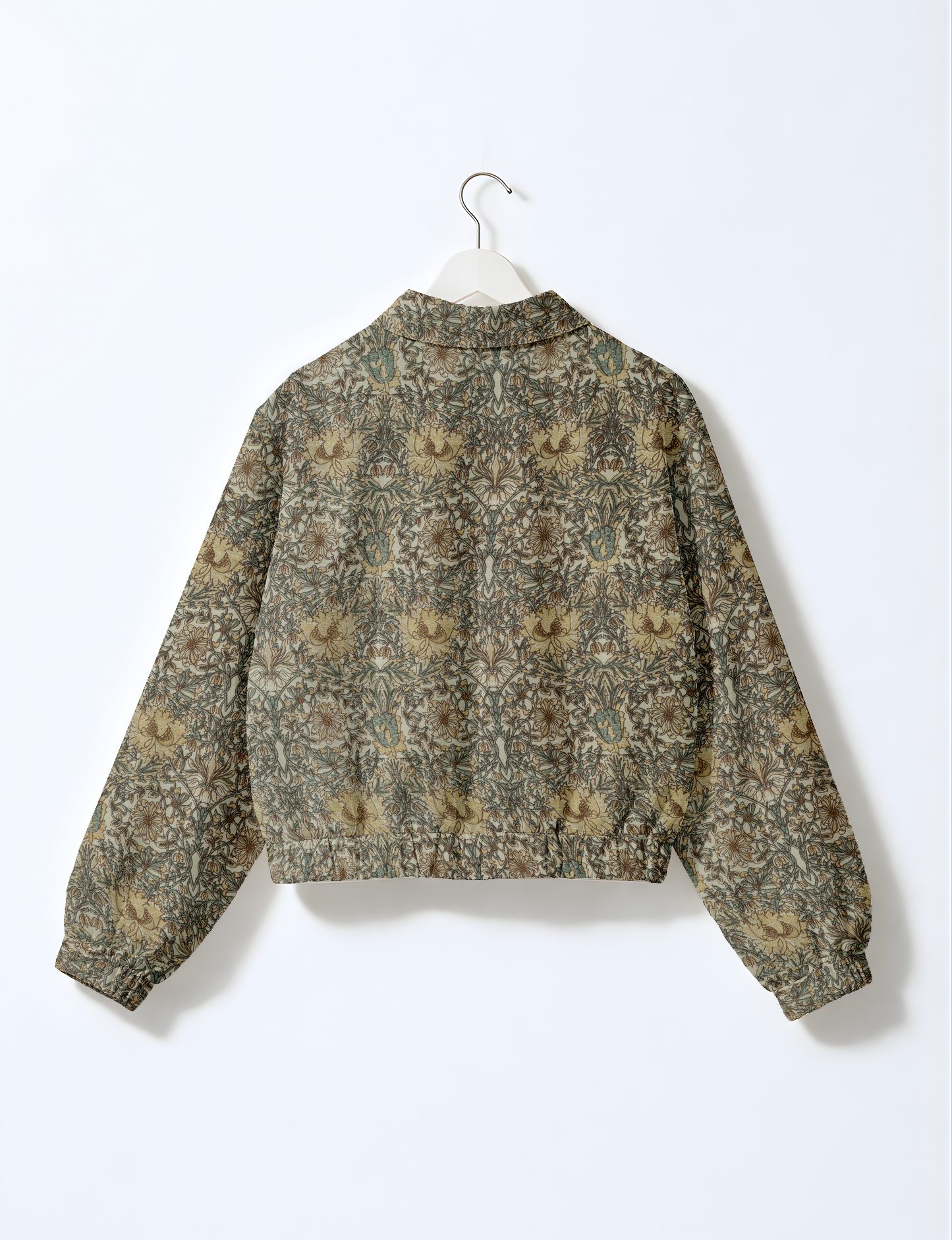 Upcycled Bomber Jacket made from recycled sari materials, featuring a cute cropped shape, elasticated hem and cuffs, and contrast sari print lining. Sustainable apparel promoting eco-friendly fashion and ethical clothing.