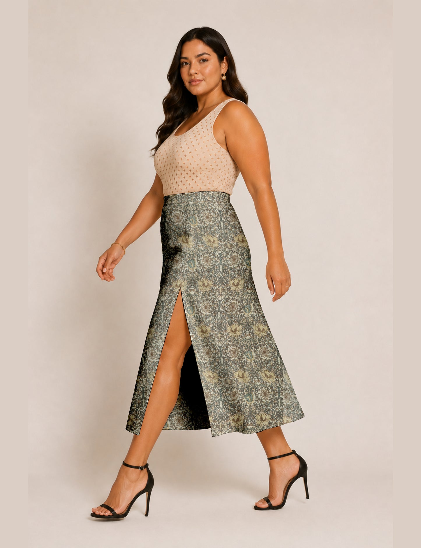 Midi A-line skirt with front slit, fitted waistband, concealed side closure, and below mid-calf length silhouette.