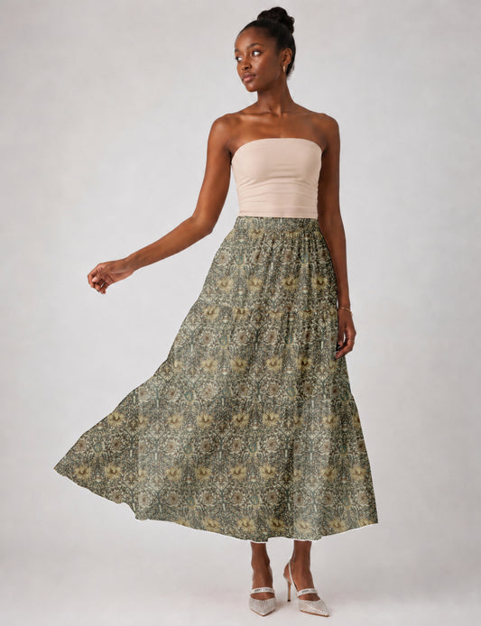 Midi tiered skirt with fitted waistband, soft knife pleats, flared silhouette, side seam pockets, and ankle-length hem