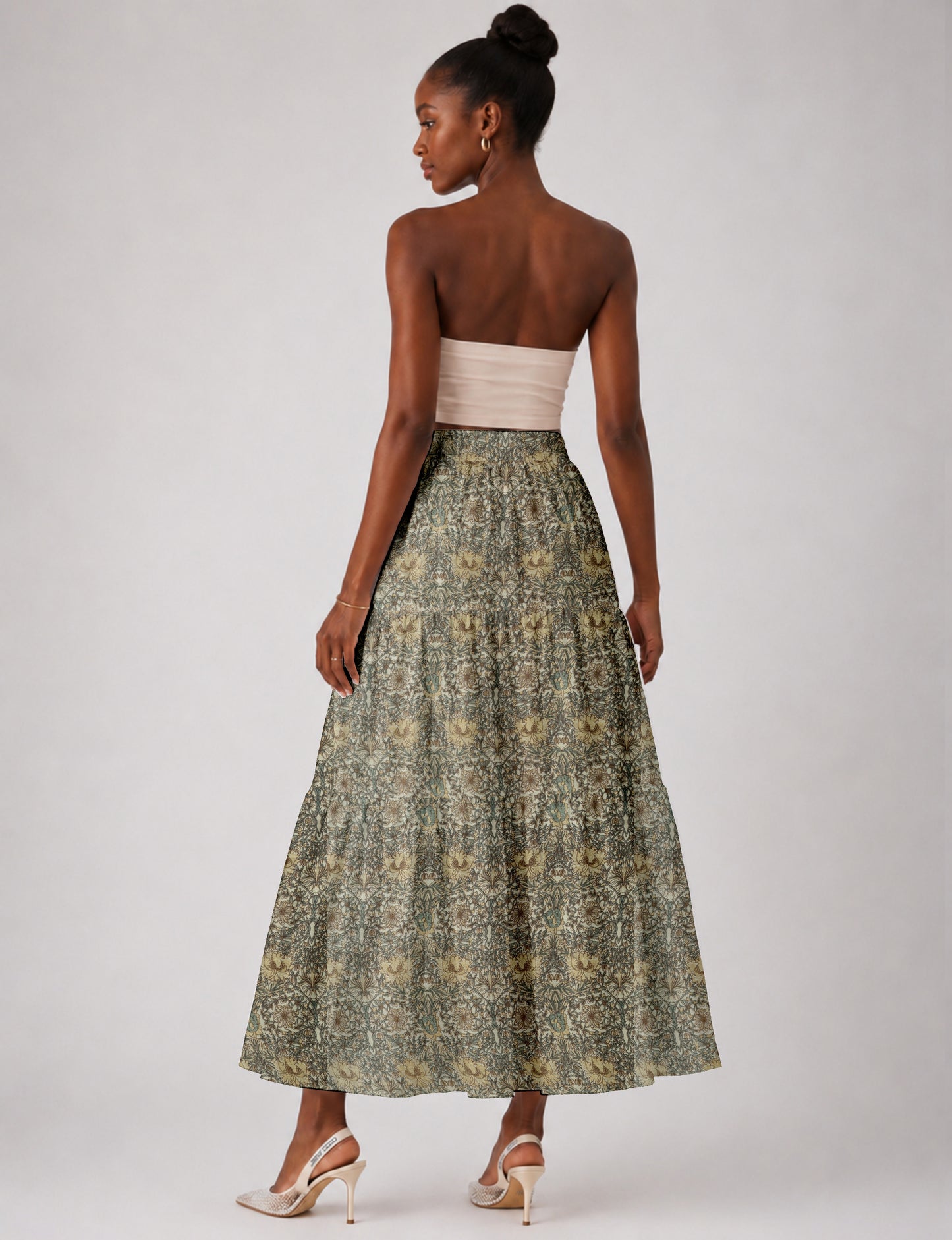 Midi tiered skirt with fitted waistband, soft knife pleats, flared silhouette, side seam pockets, and ankle-length hem