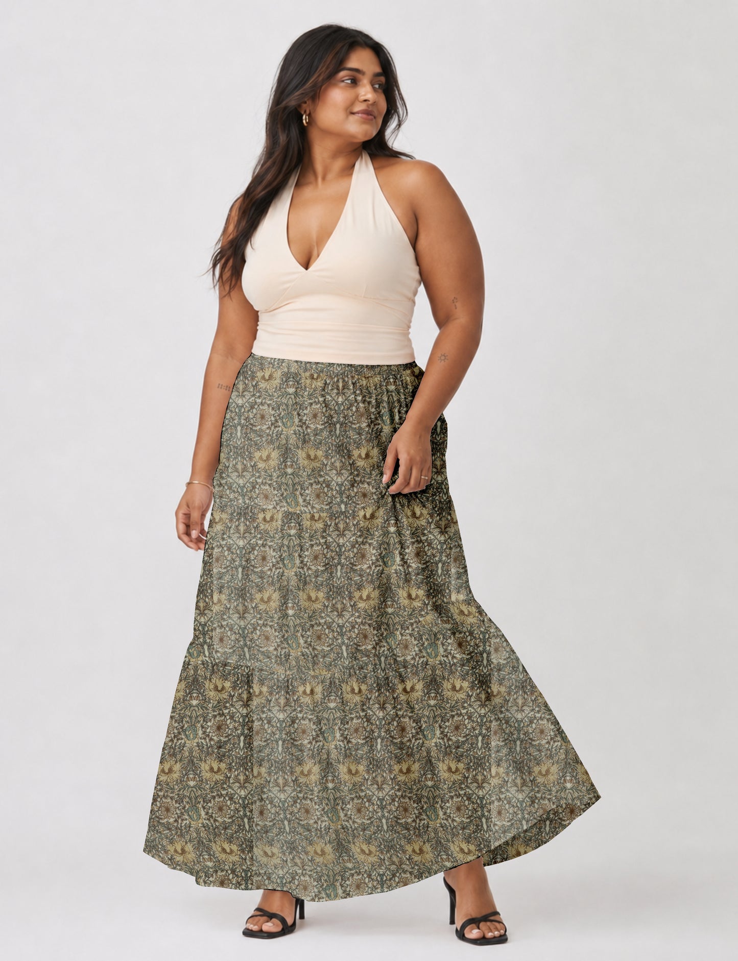 Midi tiered skirt with fitted waistband, soft knife pleats, flared silhouette, side seam pockets, and ankle-length hem
