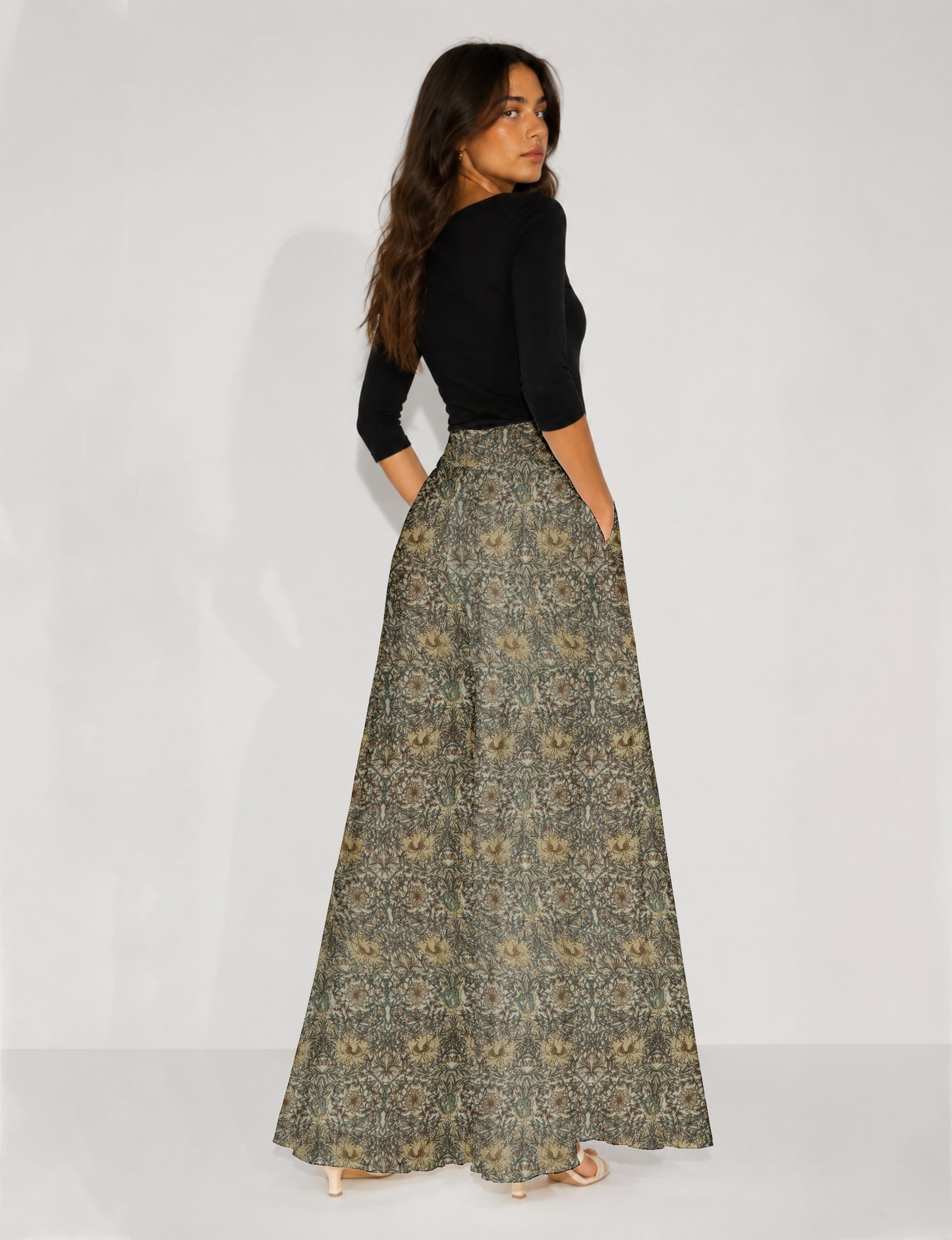 Women's wide leg palazzo trousers with a fitted waistband and relaxed flowing silhouette.