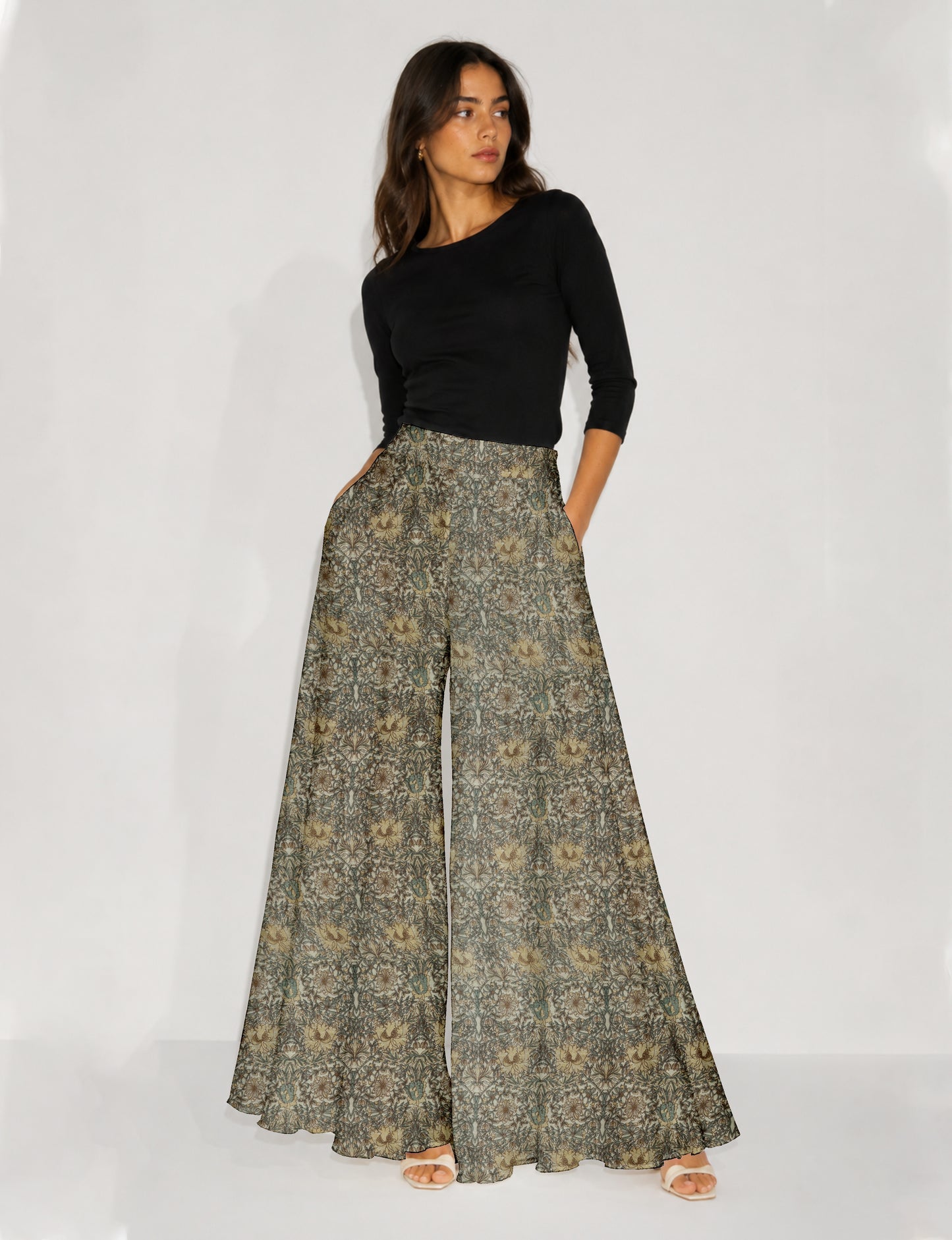 Women's wide leg palazzo trousers with a fitted waistband and relaxed flowing silhouette.
