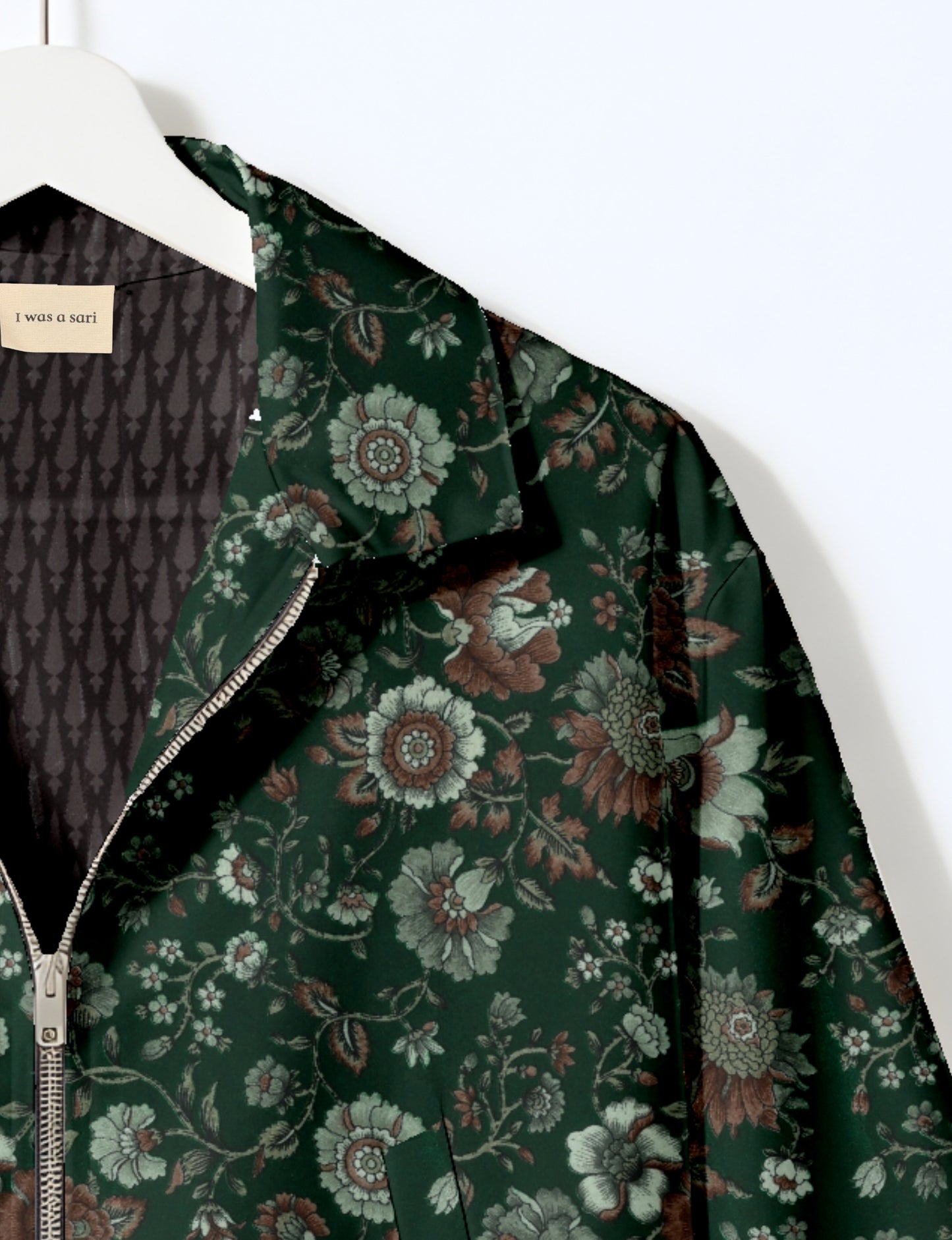 Upcycled Bomber Jacket made from recycled sari materials, featuring a cute cropped shape, elasticated hem and cuffs, and contrast sari print lining. Sustainable apparel promoting eco-friendly fashion and ethical clothing.