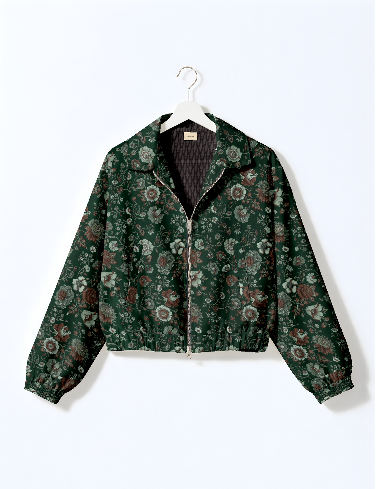 Upcycled Bomber Jacket made from recycled sari materials, featuring a cute cropped shape, elasticated hem and cuffs, and contrast sari print lining. Sustainable apparel promoting eco-friendly fashion and ethical clothing.