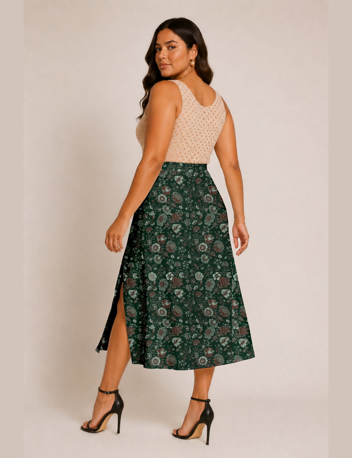 Midi A-line skirt with front slit, fitted waistband, concealed side closure, and below mid-calf length silhouette.