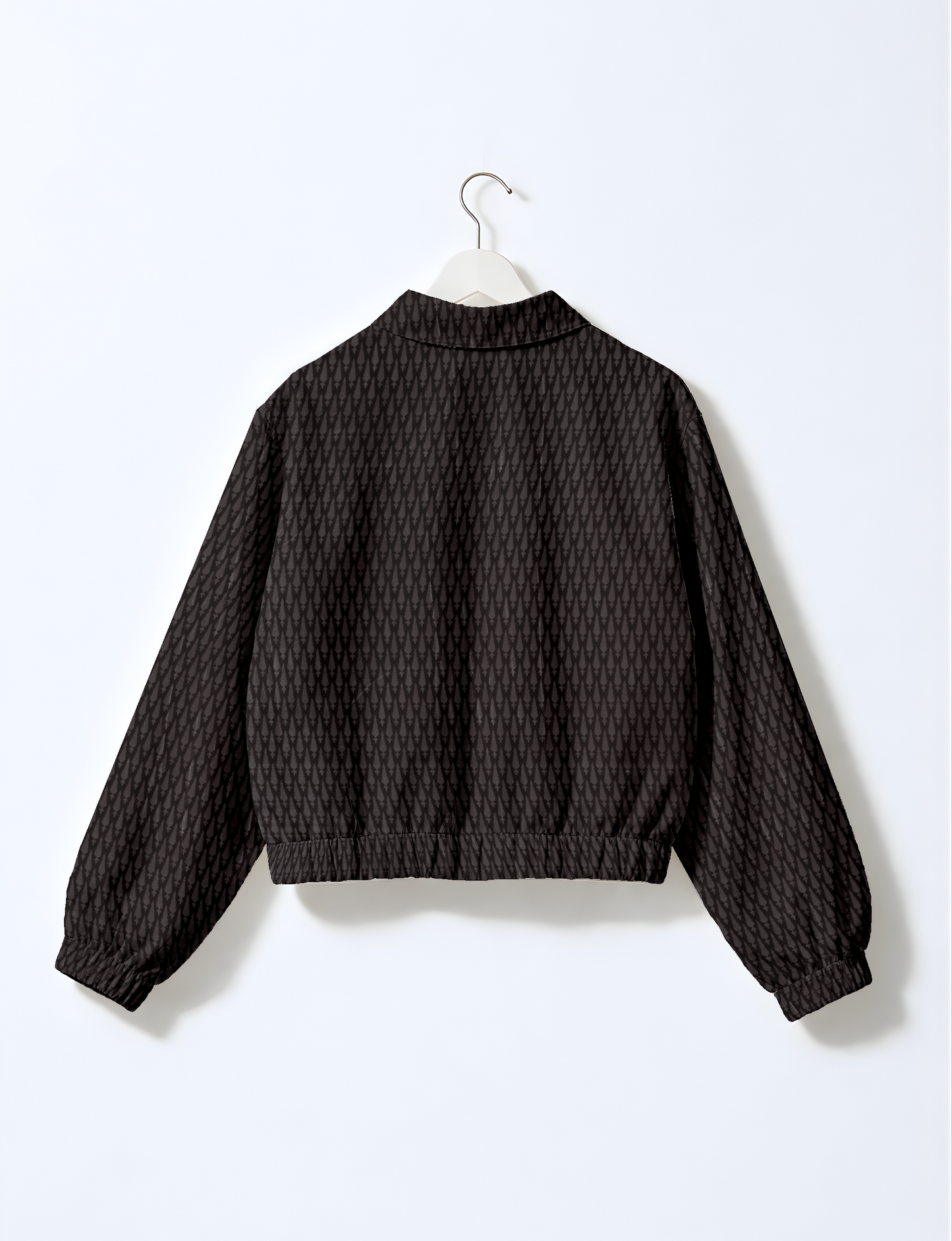 Upcycled Bomber Jacket made from recycled sari materials, featuring a cute cropped shape, elasticated hem and cuffs, and contrast sari print lining. Sustainable apparel promoting eco-friendly fashion and ethical clothing.