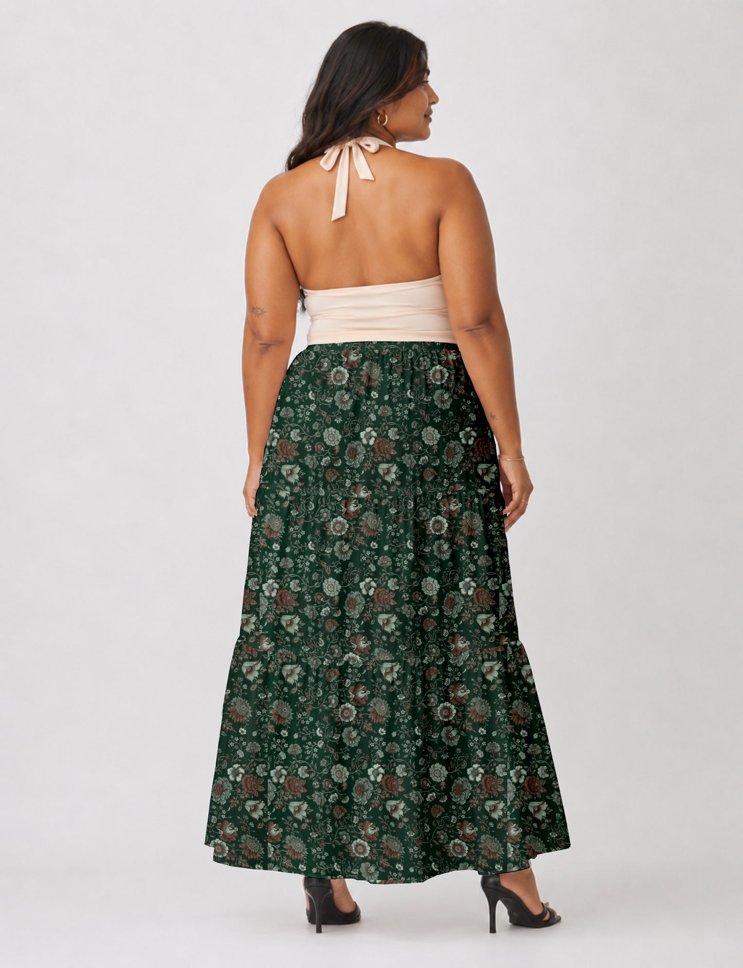 Midi tiered skirt with fitted waistband, soft knife pleats, flared silhouette, side seam pockets, and ankle-length hem