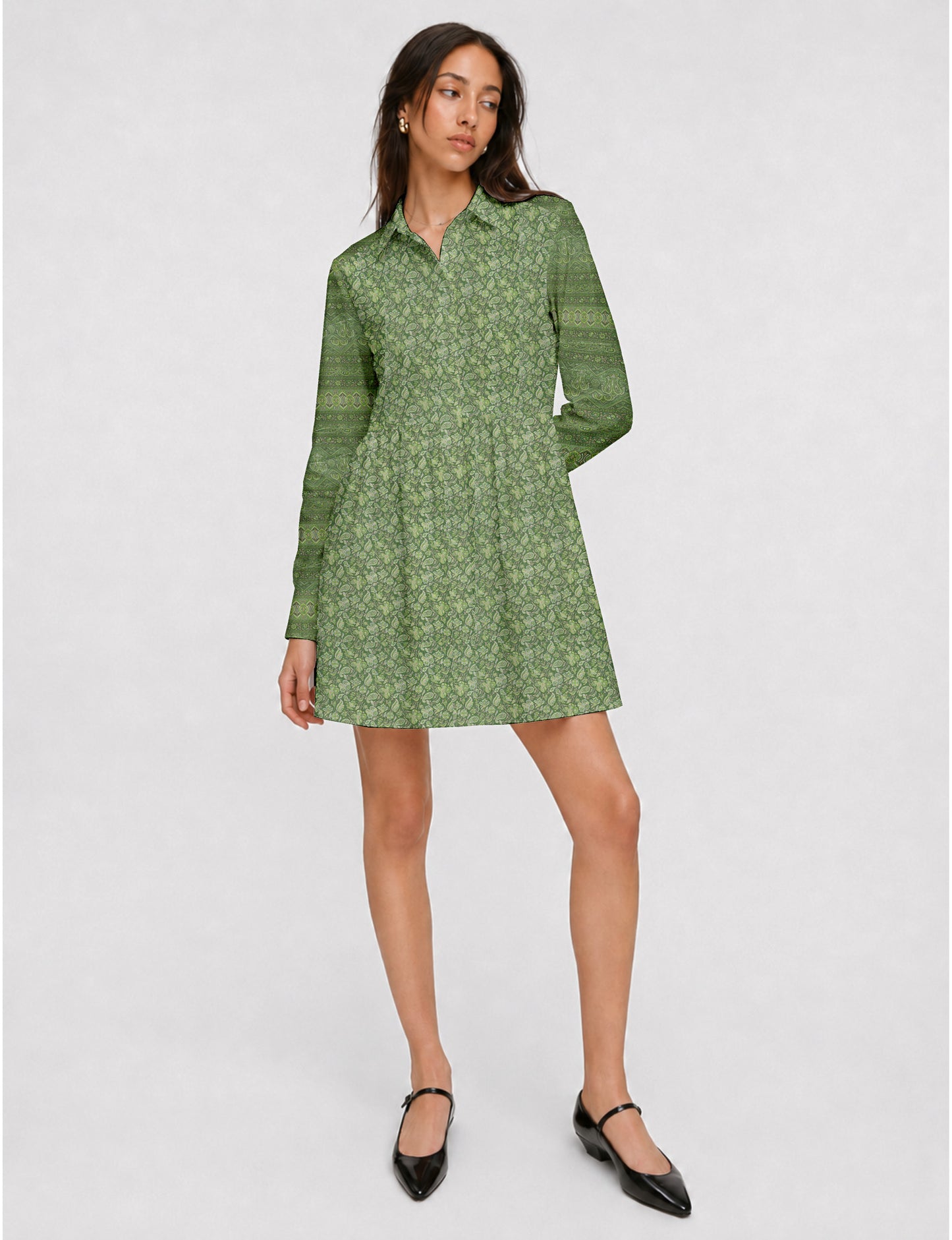 Short shirt dress with a relaxed A-line silhouette, point collar, partial button placket, gathered waist, side pockets, and full-length cuffed sleeves.