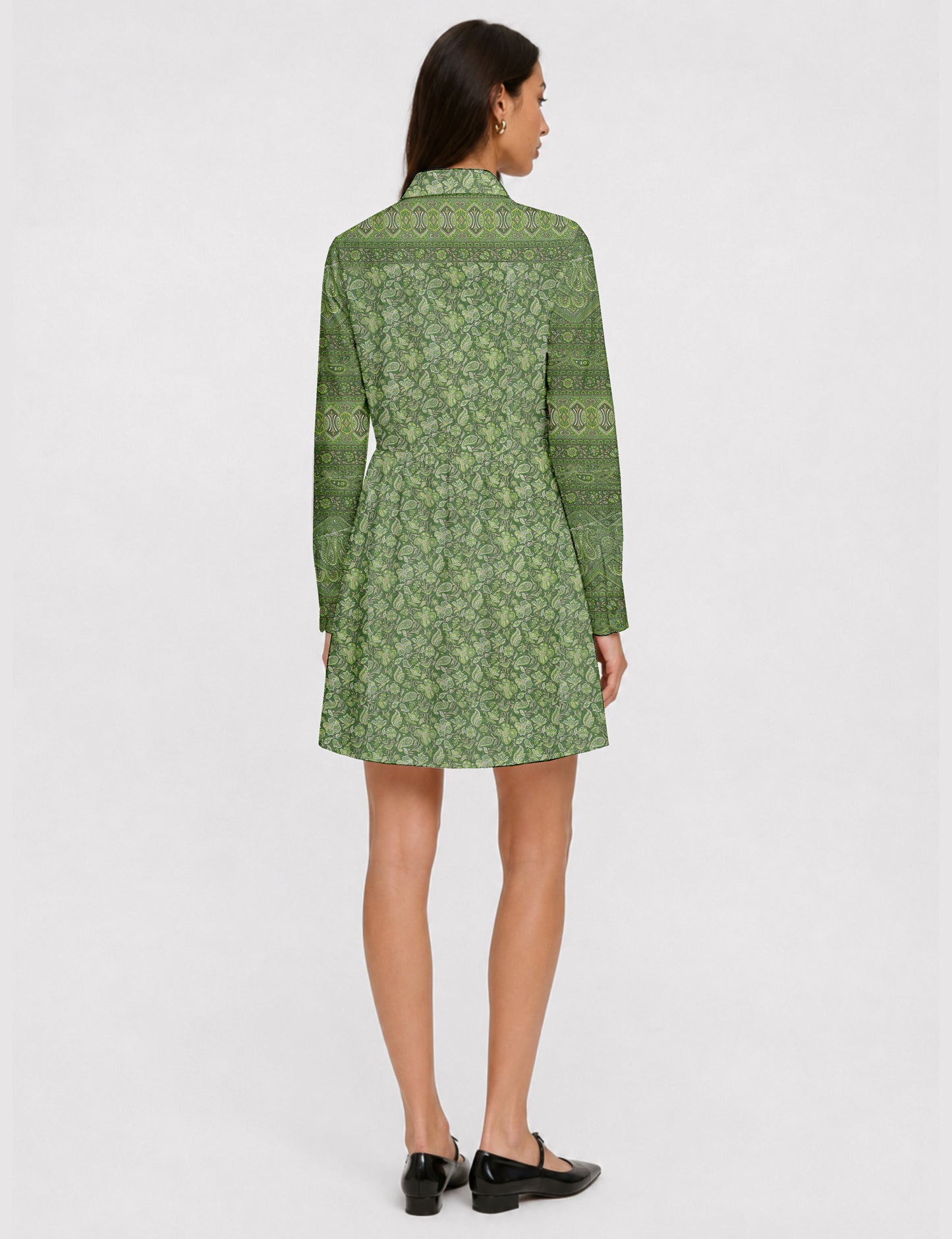 Short shirt dress with a relaxed A-line silhouette, point collar, partial button placket, gathered waist, side pockets, and full-length cuffed sleeves.