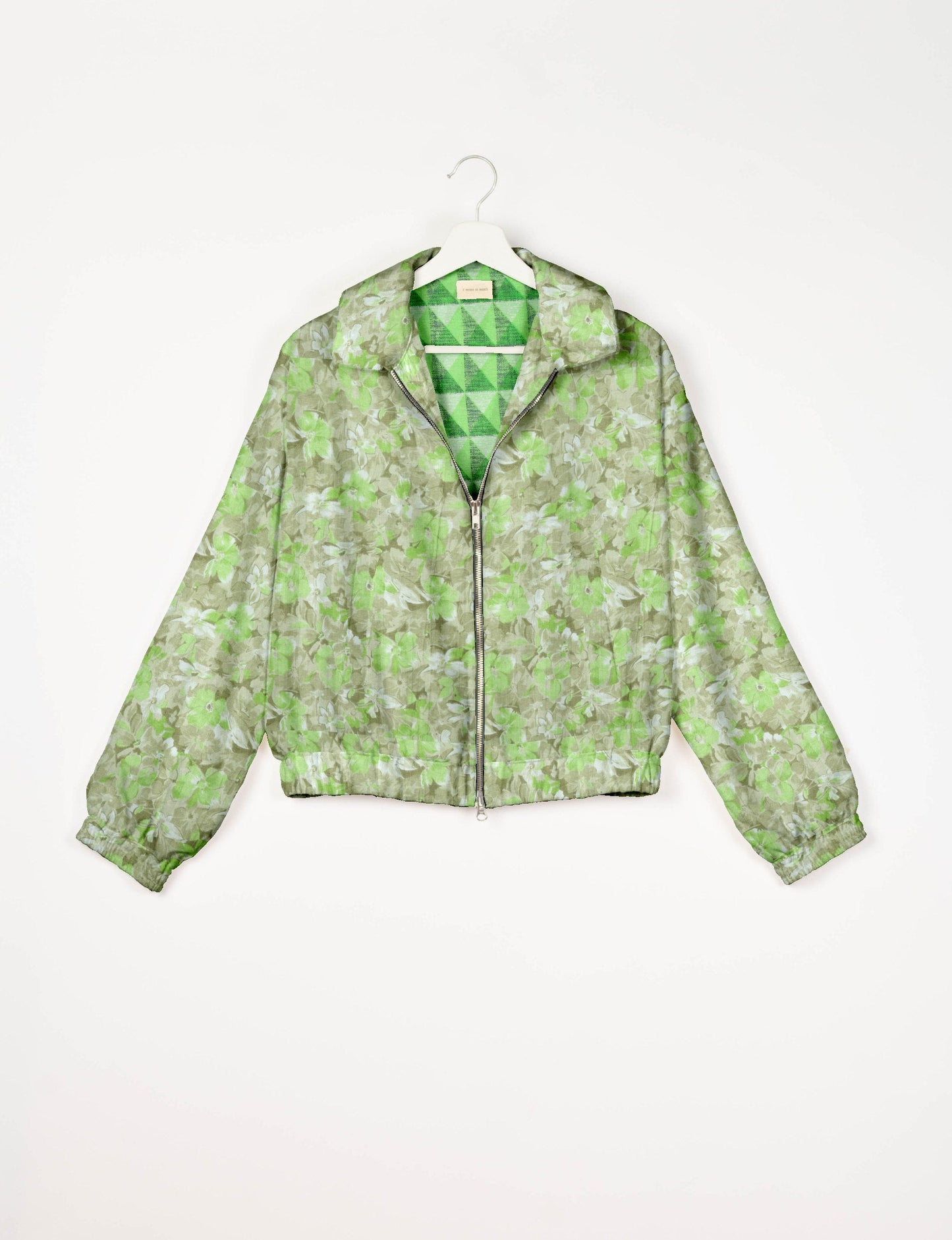 Upcycled Bomber Jacket made from recycled sari materials, featuring a cute cropped shape, elasticated hem and cuffs, and contrast sari print lining. Sustainable apparel promoting eco-friendly fashion and ethical clothing.
