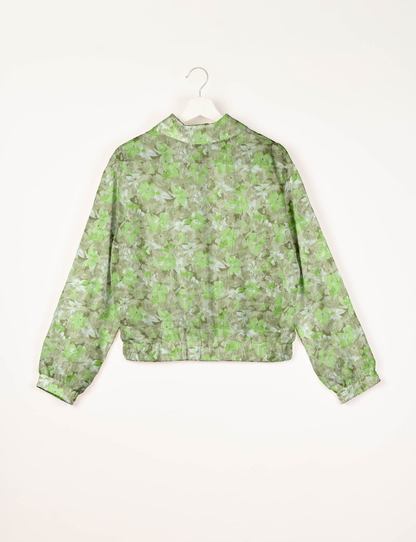Upcycled Bomber Jacket made from recycled sari materials, featuring a cute cropped shape, elasticated hem and cuffs, and contrast sari print lining. Sustainable apparel promoting eco-friendly fashion and ethical clothing.