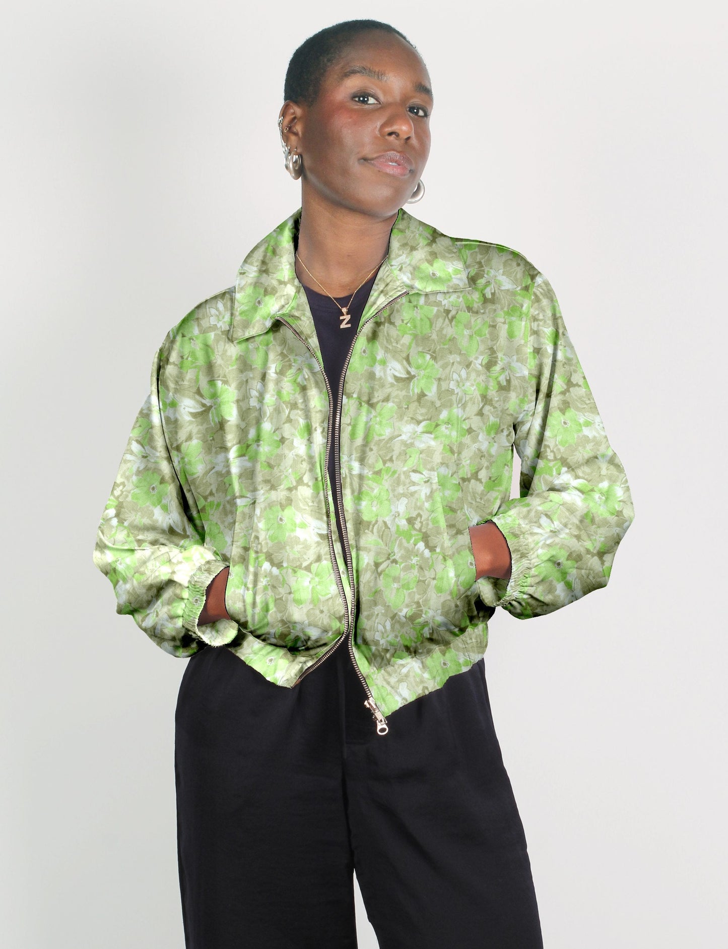 Upcycled Bomber Jacket made from recycled sari materials, featuring a cute cropped shape, elasticated hem and cuffs, and contrast sari print lining. Sustainable apparel promoting eco-friendly fashion and ethical clothing.