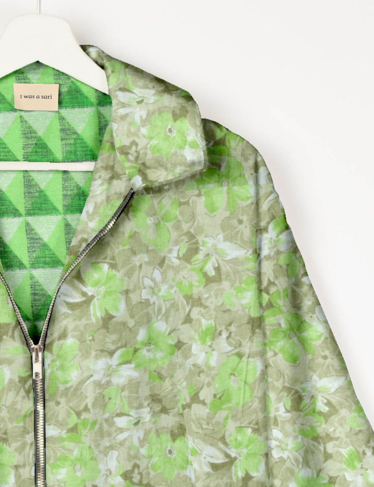 Upcycled Bomber Jacket made from recycled sari materials, featuring a cute cropped shape, elasticated hem and cuffs, and contrast sari print lining. Sustainable apparel promoting eco-friendly fashion and ethical clothing.