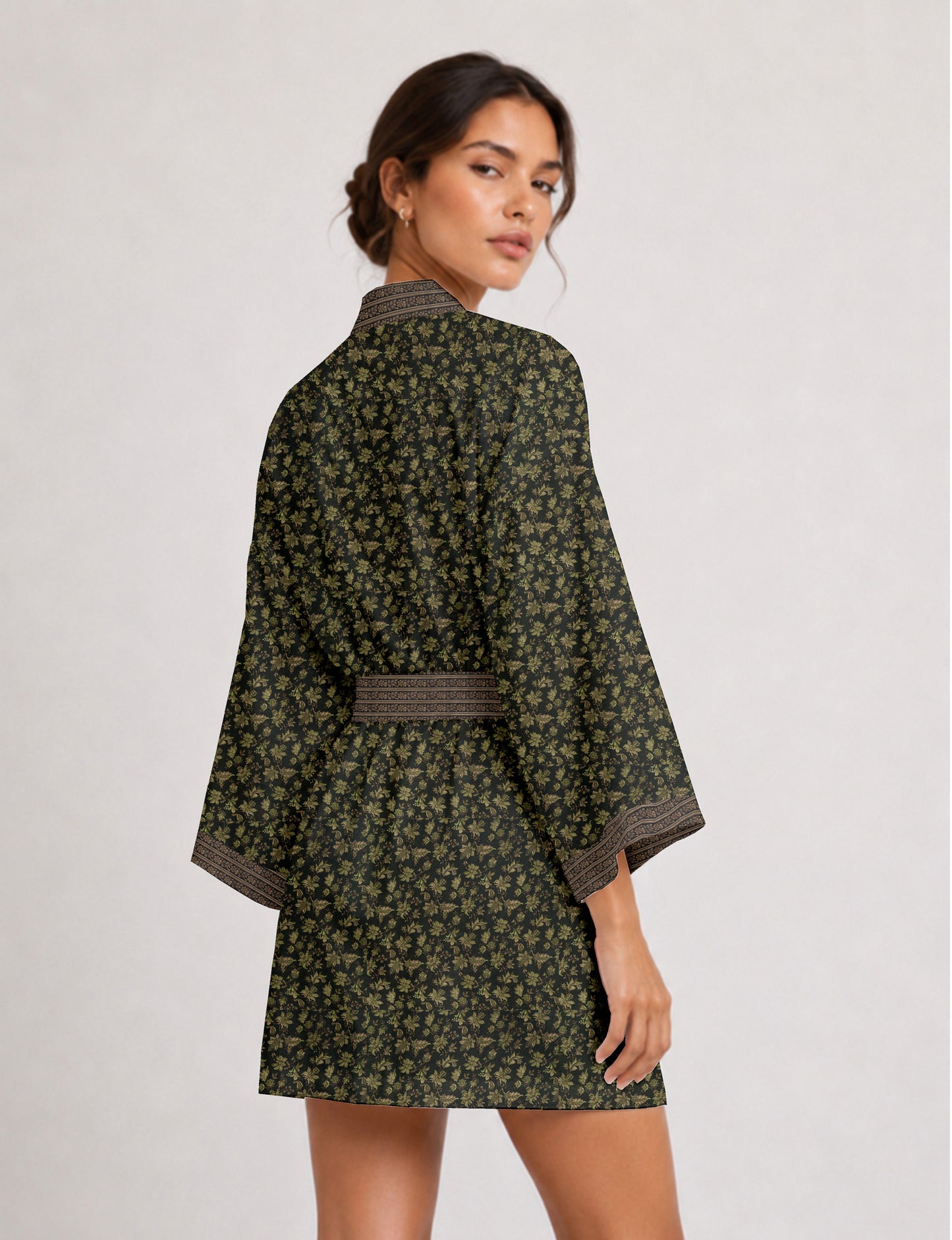 Short kimono robe with wrap front, V-neckline, wide sleeves, waist tie, and concealed skort detail.