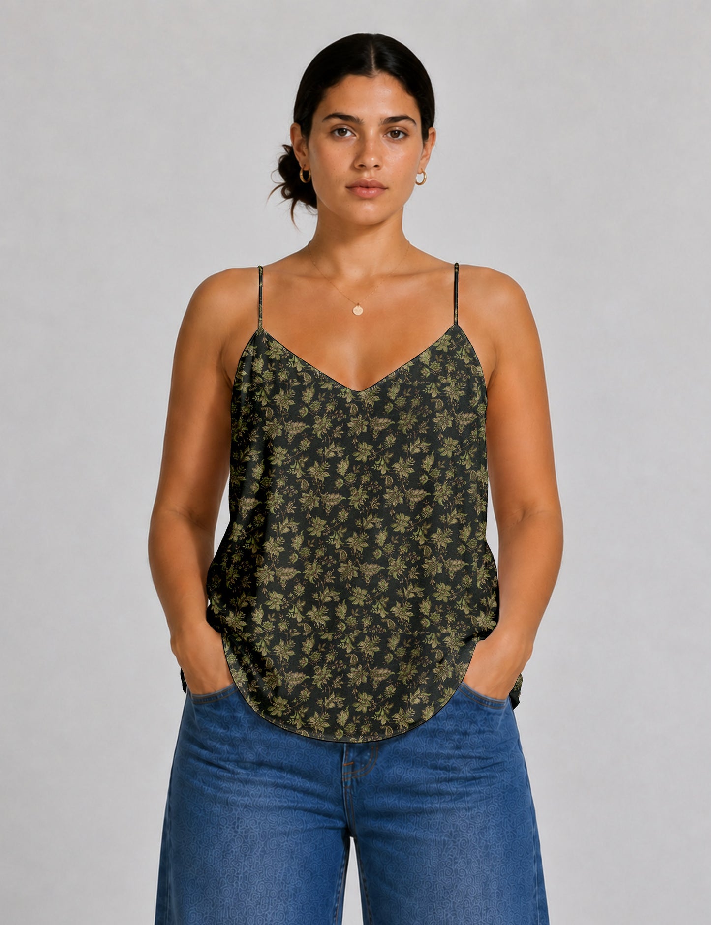 Women's sleeveless slip top with a relaxed straight fit, soft V-neckline, deep V-back, and delicate spaghetti straps.