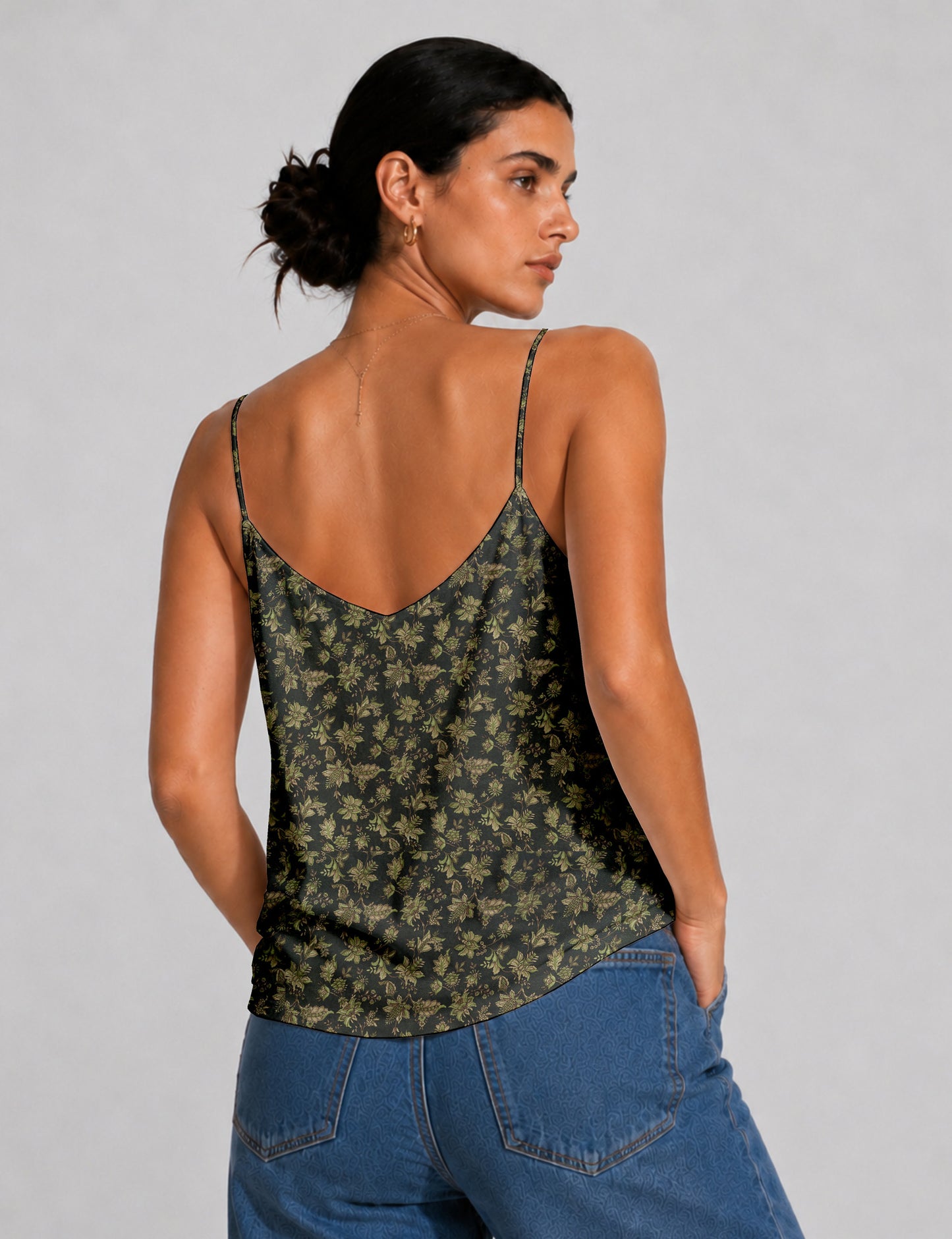 Women's sleeveless slip top with a relaxed straight fit, soft V-neckline, deep V-back, and delicate spaghetti straps.