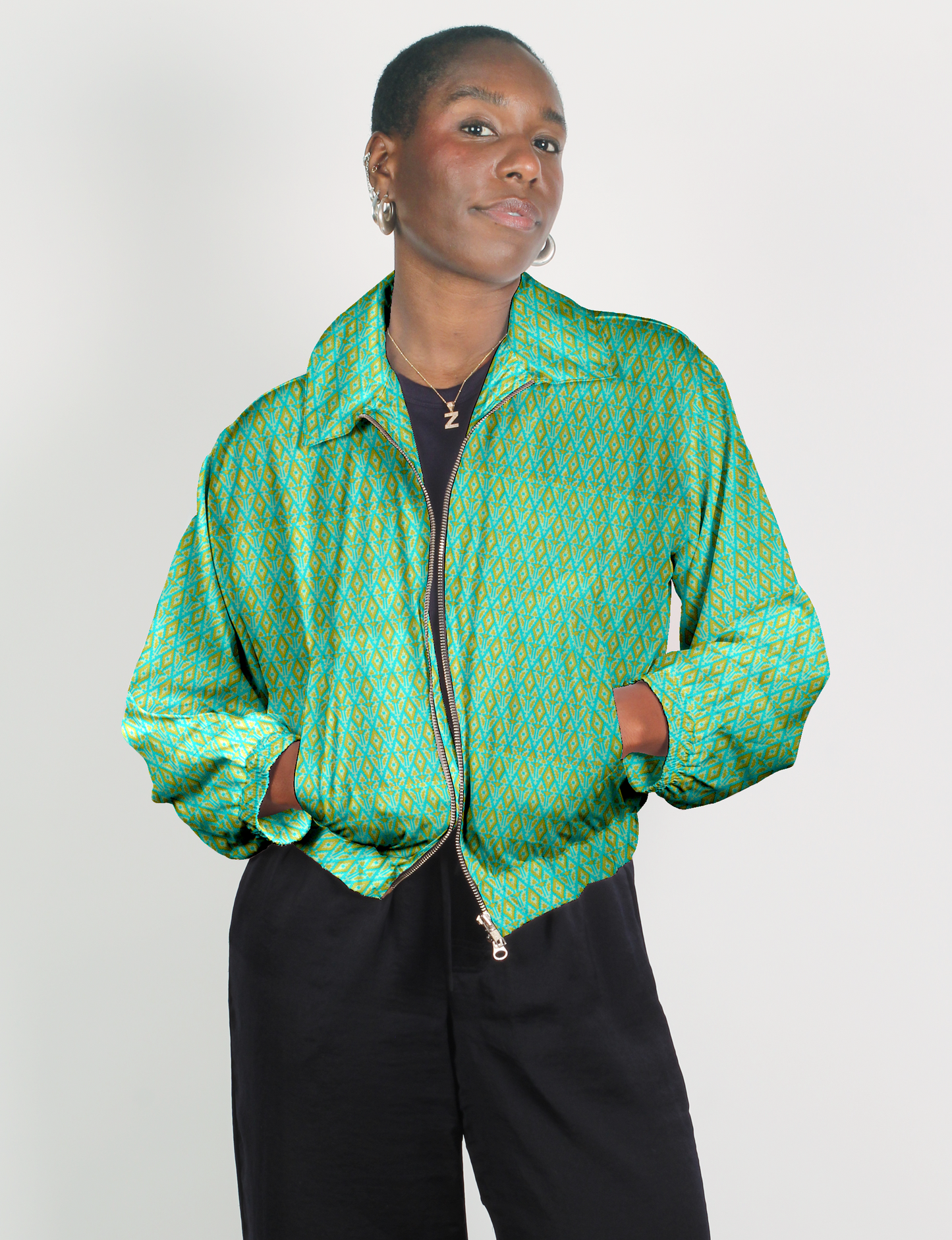 Upcycled Bomber Jacket made from recycled sari materials, featuring a cute cropped shape, elasticated hem and cuffs, and contrast sari print lining. Sustainable apparel promoting eco-friendly fashion and ethical clothing.