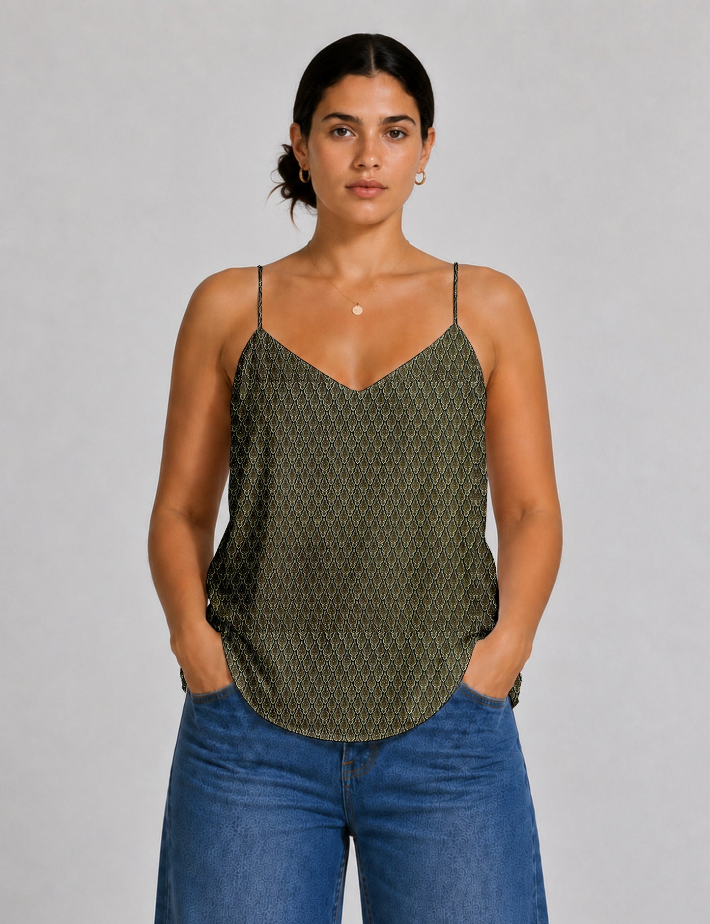 Women's sleeveless slip top with a relaxed straight fit, soft V-neckline, deep V-back, and delicate spaghetti straps.