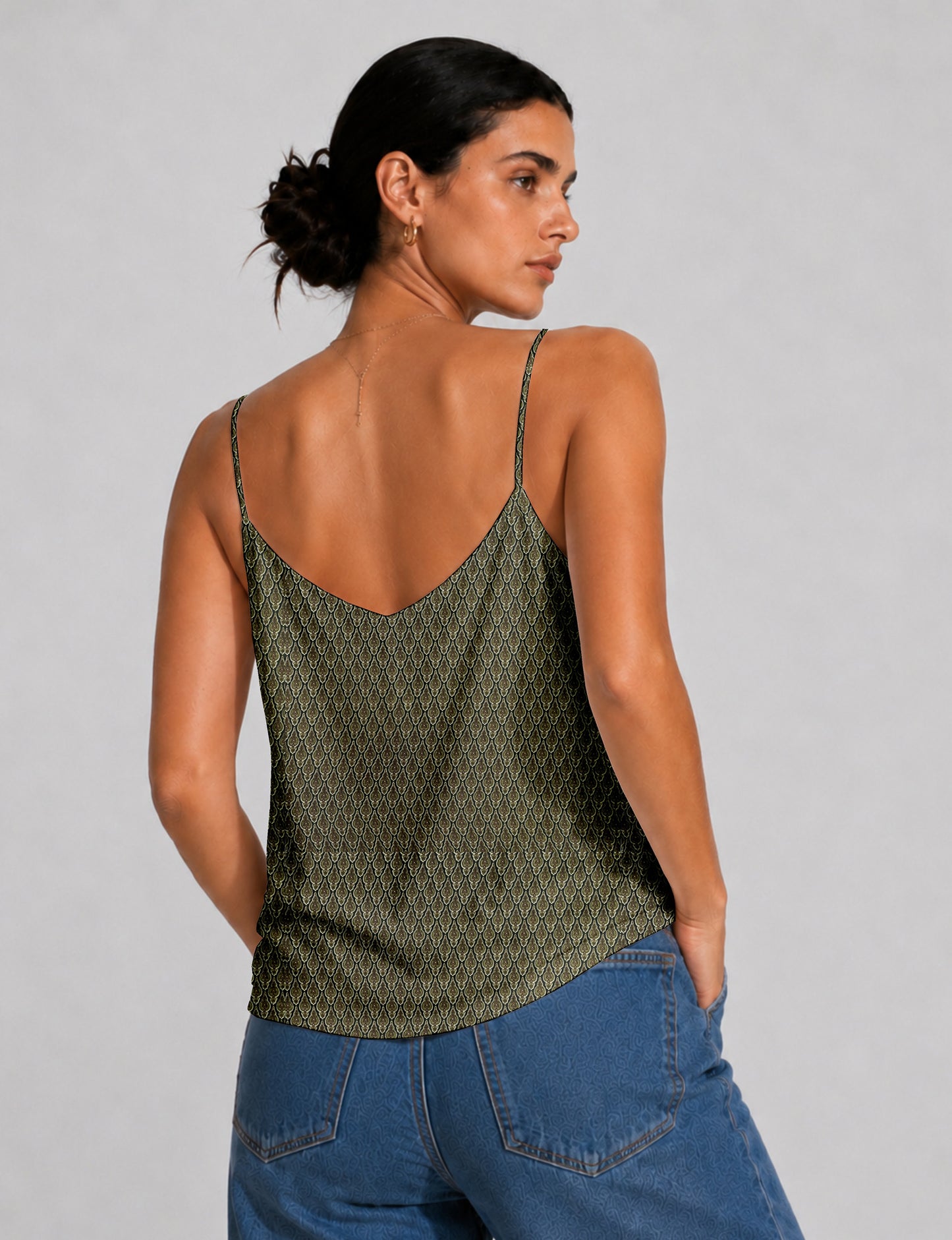 Women's sleeveless slip top with a relaxed straight fit, soft V-neckline, deep V-back, and delicate spaghetti straps.