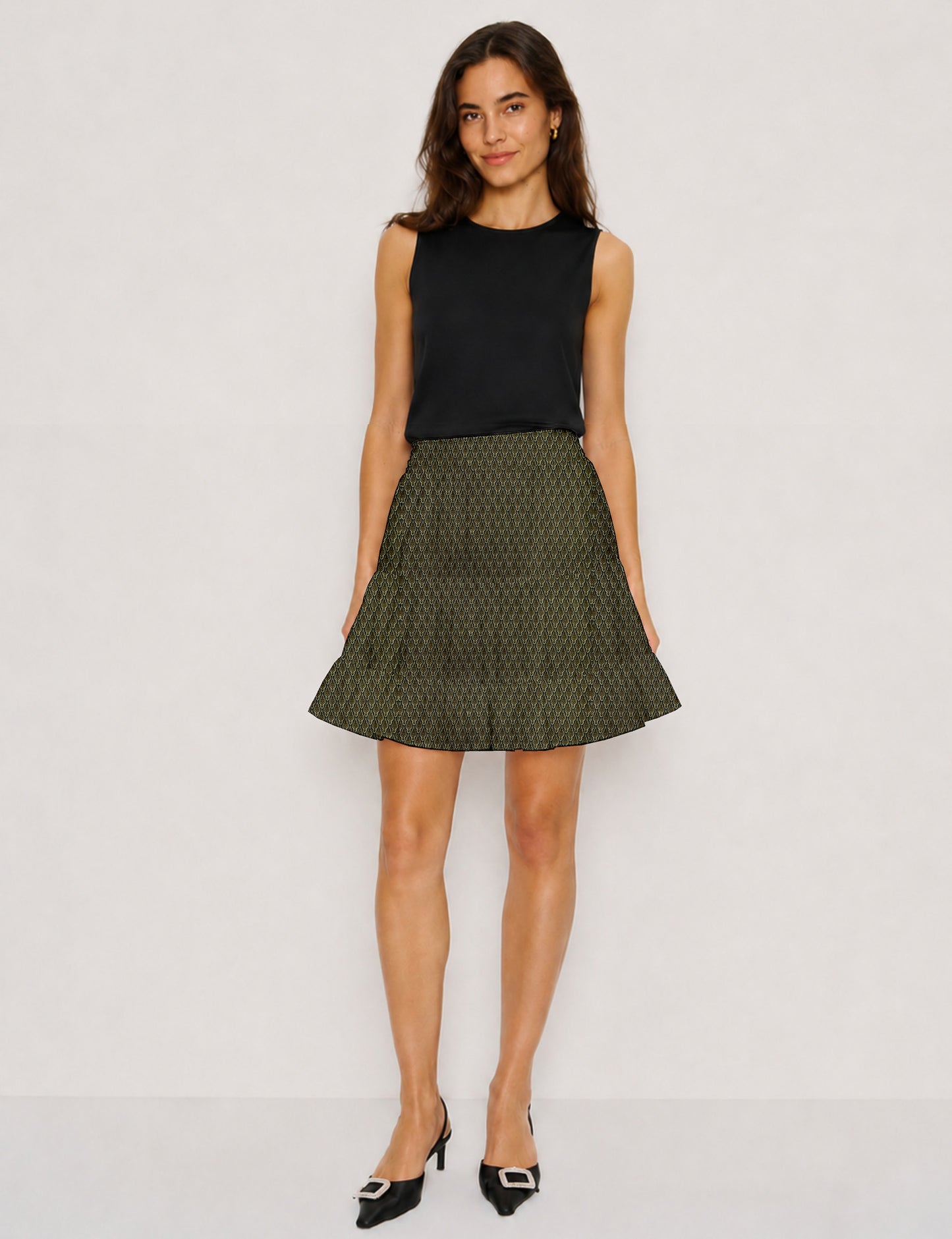 Short tiered skirt with a fitted waistband, knife pleats, softly flared silhouette, side seam pockets, and above-the-knee length.