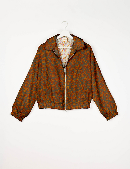 Upcycled Bomber Jacket made from recycled sari materials, featuring a cute cropped shape, elasticated hem and cuffs, and contrast sari print lining. Sustainable apparel promoting eco-friendly fashion and ethical clothing.