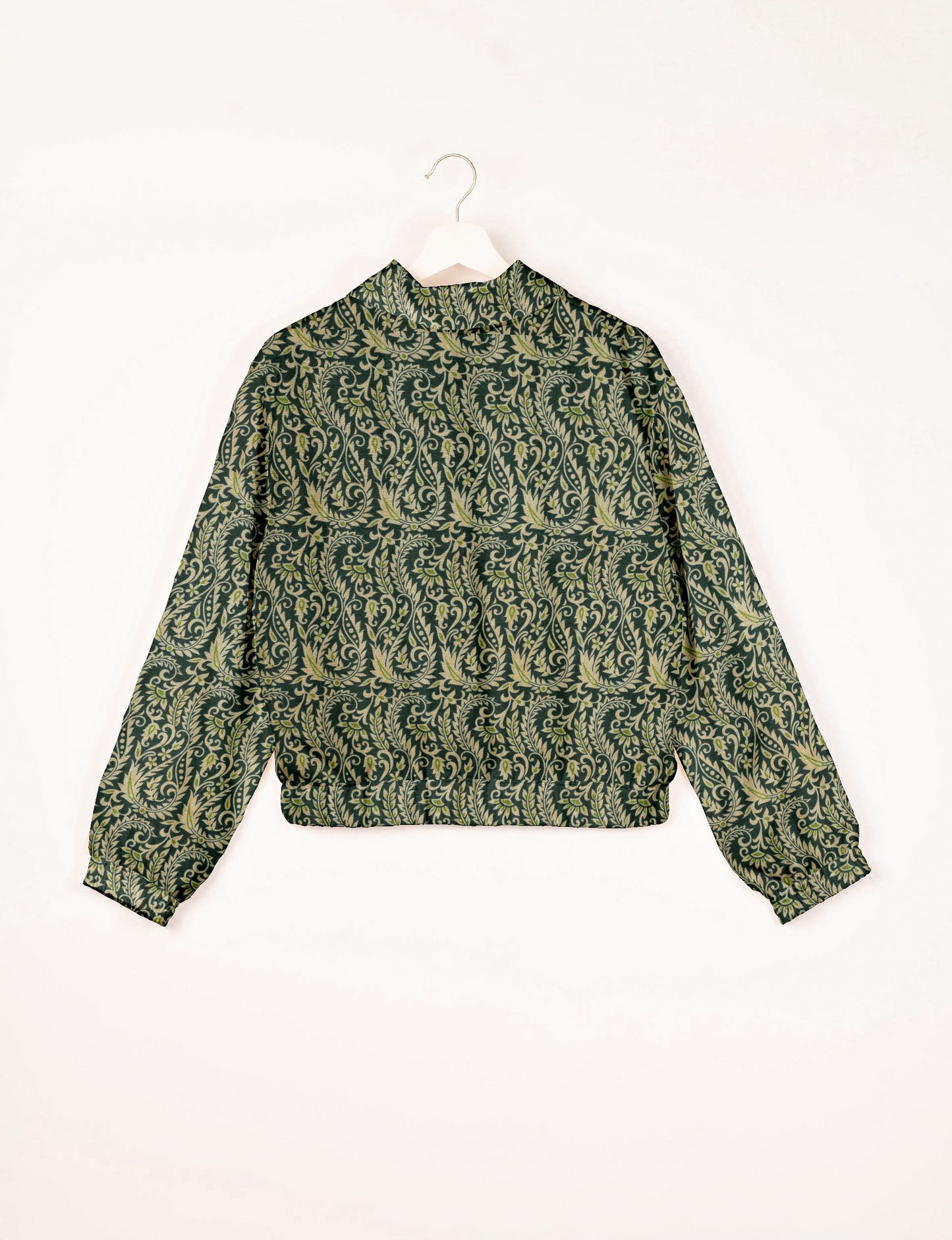 Green bomber jacket with intricate light green leaf and vine pattern, elastic cuffs and waistband, shown from back on hanger