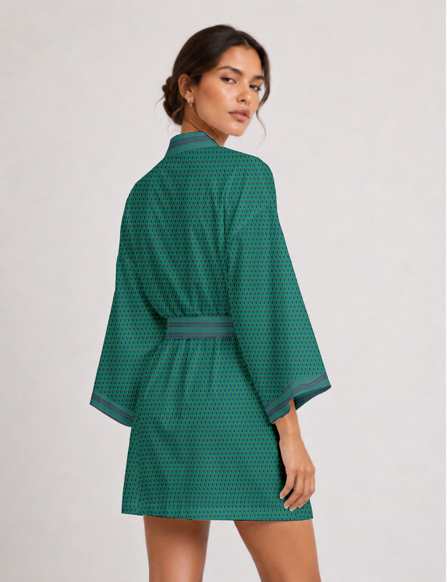 Short kimono robe with wrap front, V-neckline, wide sleeves, waist tie, and concealed skort detail.