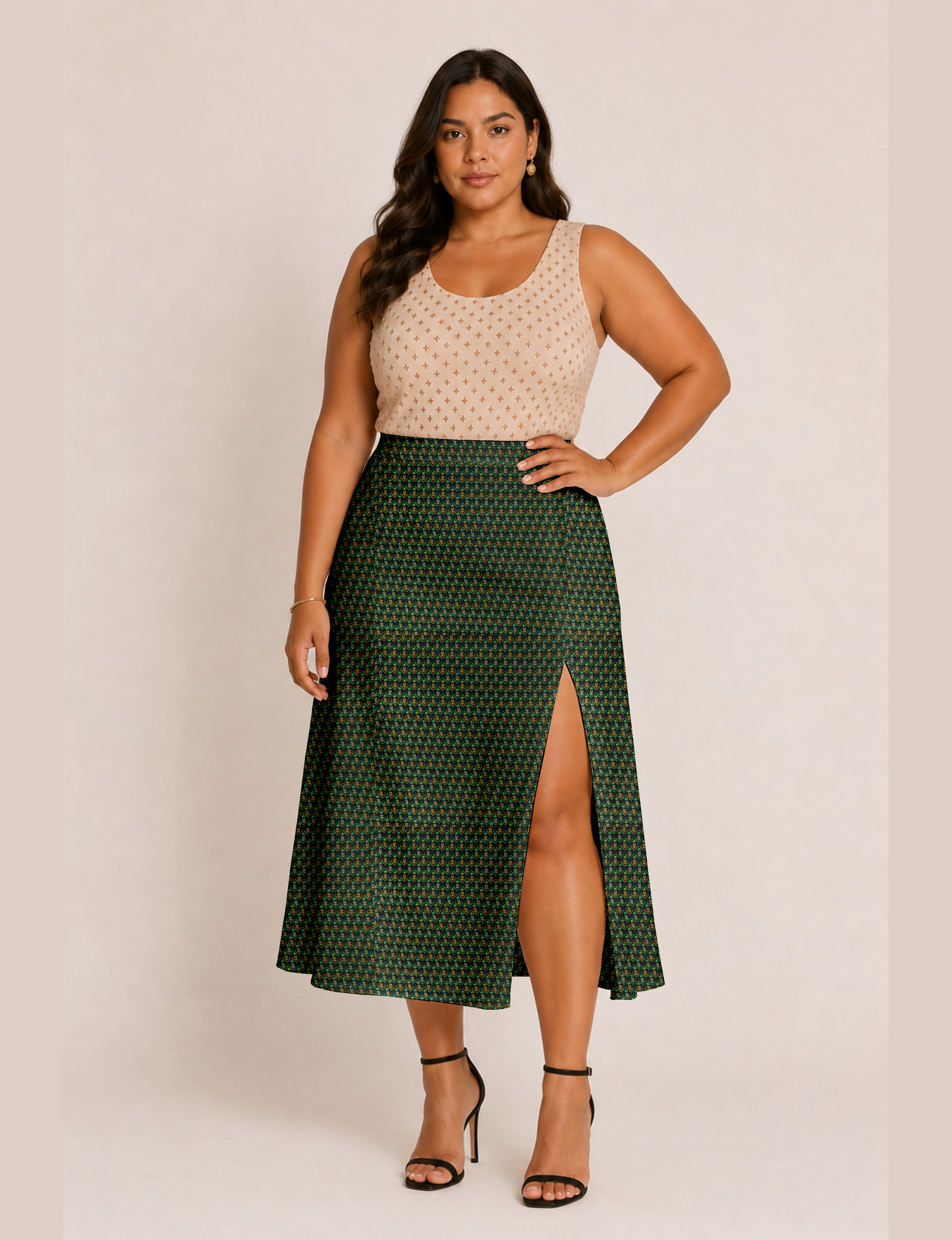 Woman wearing a yellow and black micro patterned A-line skirt with front slit, paired with beige sleeveless top and black