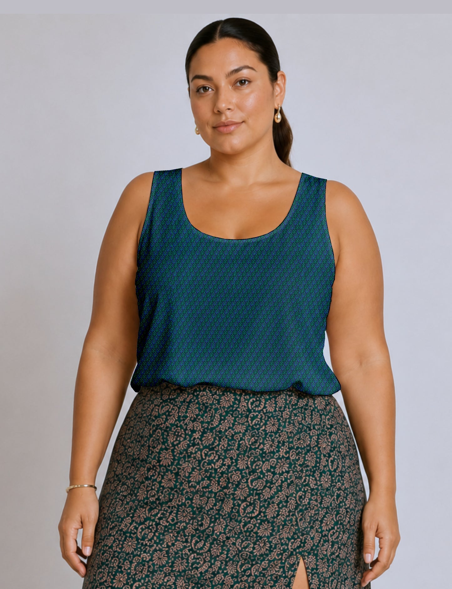 Women's sleeveless blouse with a relaxed straight fit, wide scoop neckline, deep scoop back, and hip-length silhouette.