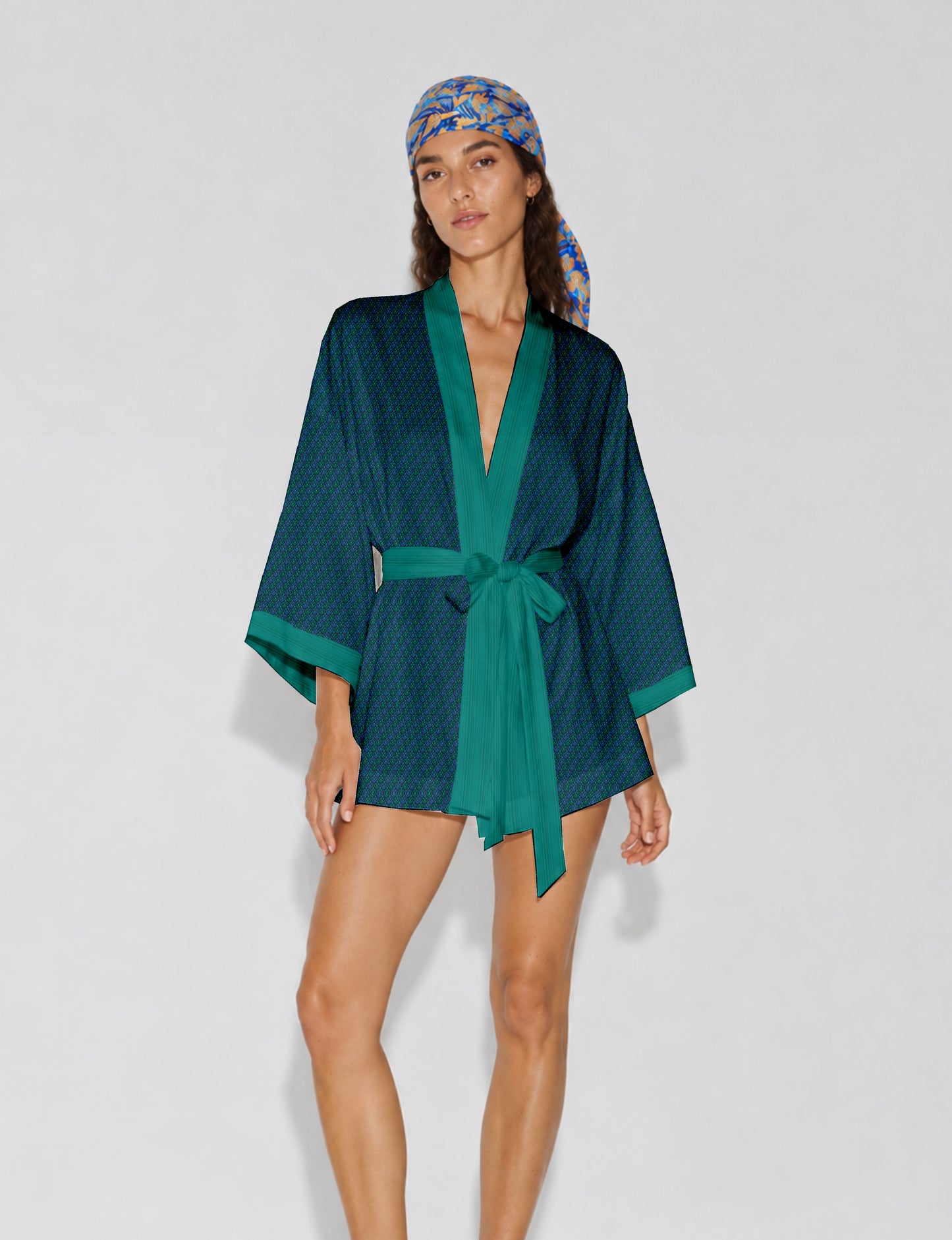 Short kimono robe with wrap front, V-neckline, wide sleeves, waist tie, and concealed skort detail.