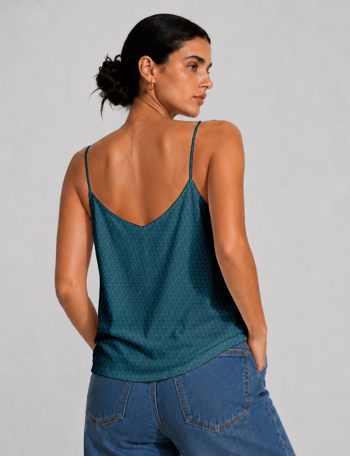 Women's sleeveless slip top with a relaxed straight fit, soft V-neckline, deep V-back, and delicate spaghetti straps.