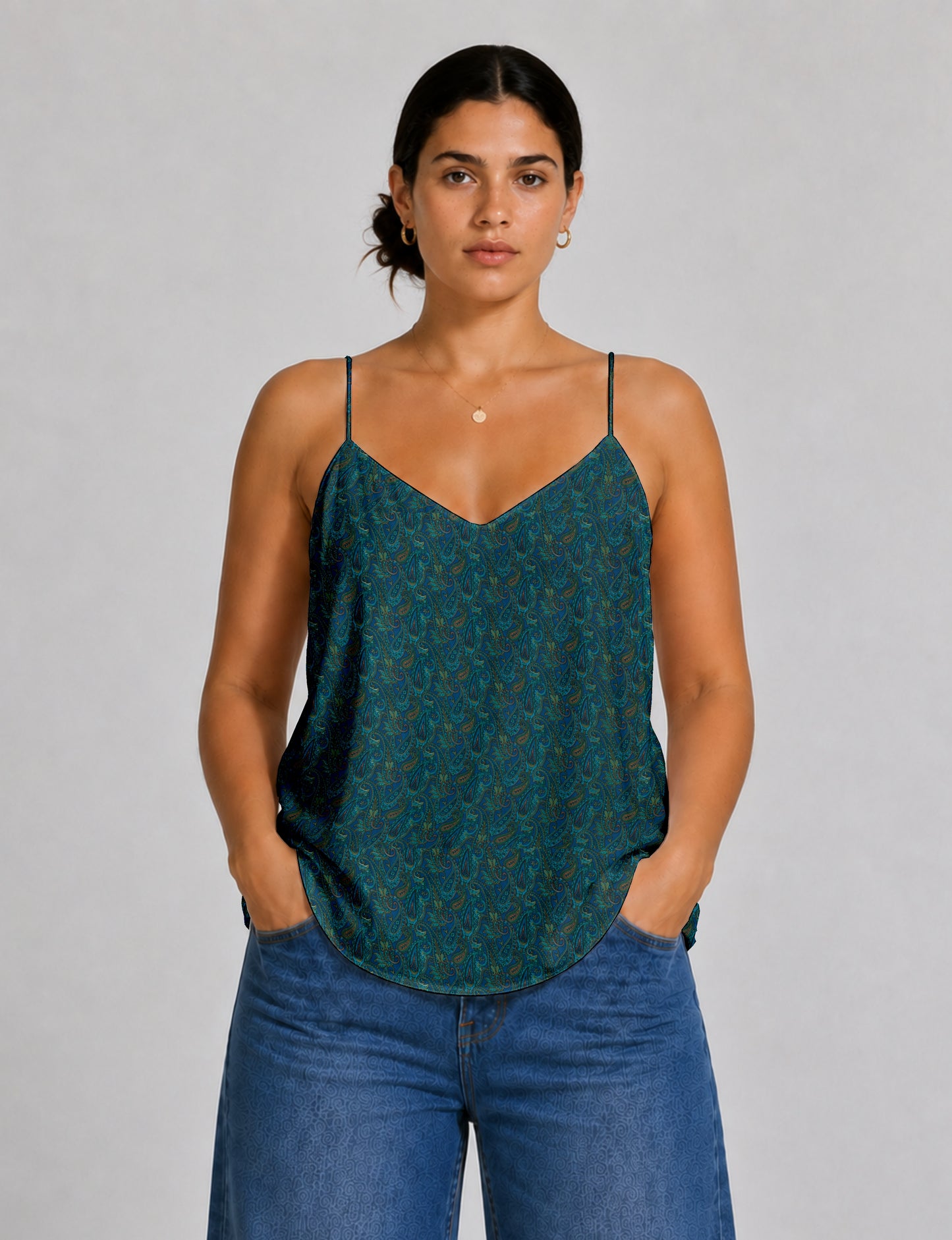 Women's sleeveless slip top with a relaxed straight fit, soft V-neckline, deep V-back, and delicate spaghetti straps.