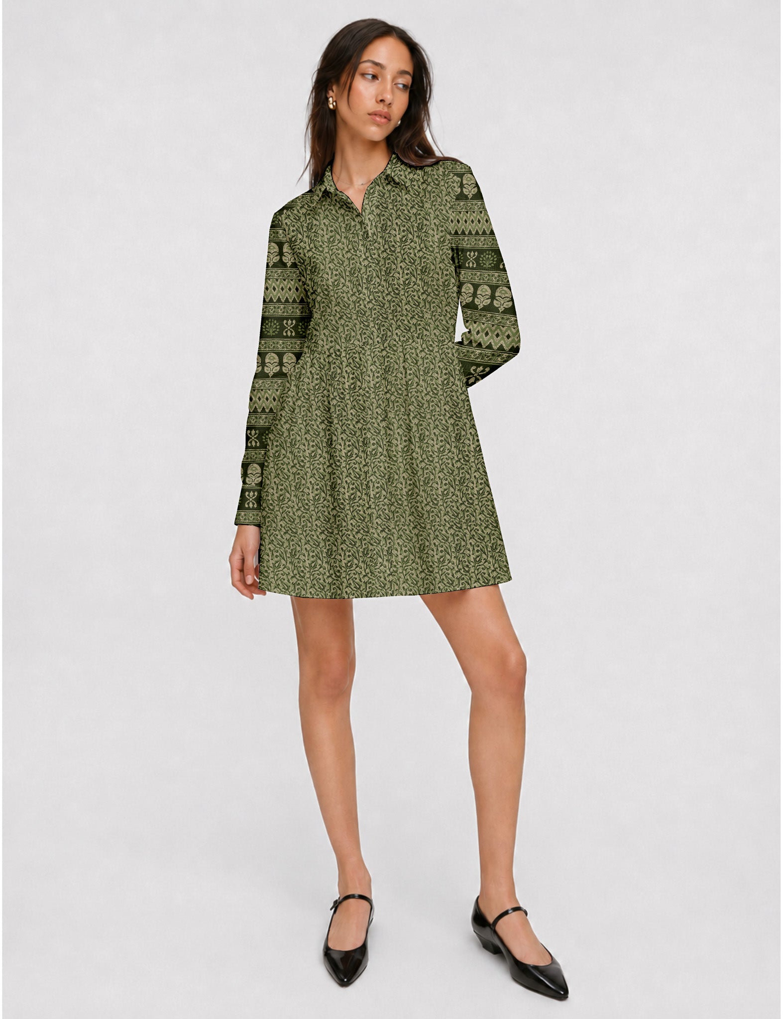 Short shirt dress with a relaxed A-line silhouette, point collar, partial button placket, gathered waist, side pockets, and full-length cuffed sleeves.