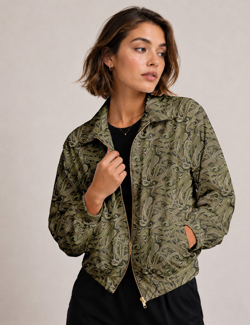 Woman wearing a yellow floral bomber jacket with front zipper, elastic cuffs, and side pockets, shown from front view