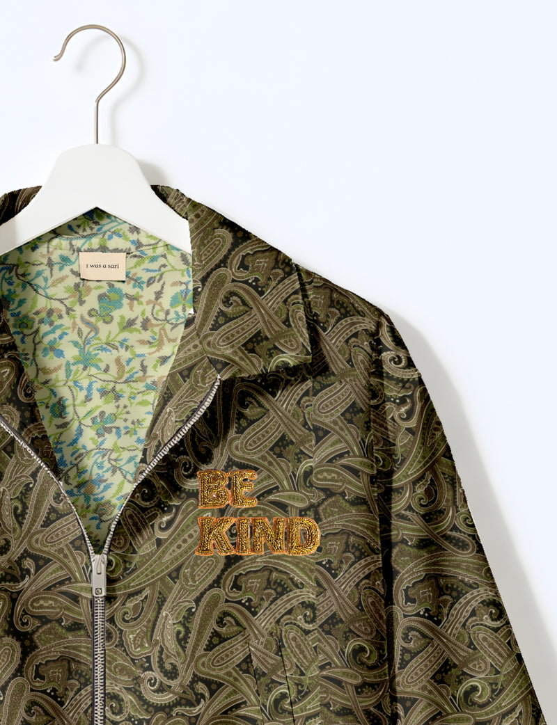 BE KIND Bomber jacket made from upcycled sari fabric with handcrafted Aari embroidery by female artisans.
