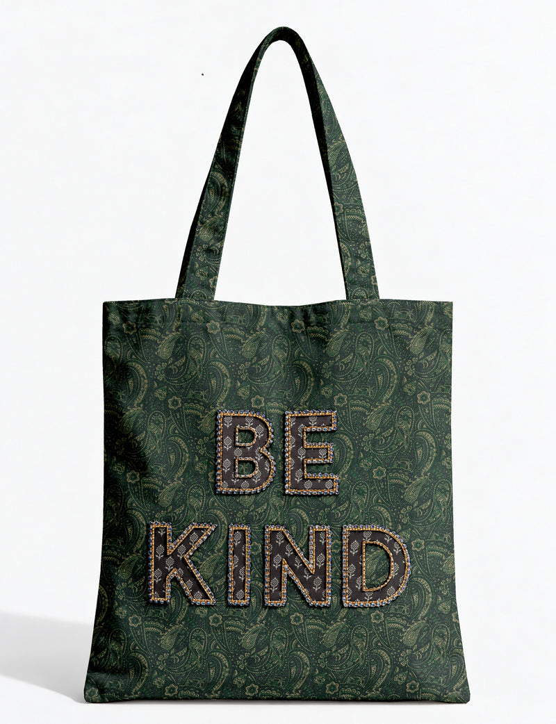 Be Kind tote bag with contrast sari fabric appliqué lettering, double shoulder straps, and front slip pocket.