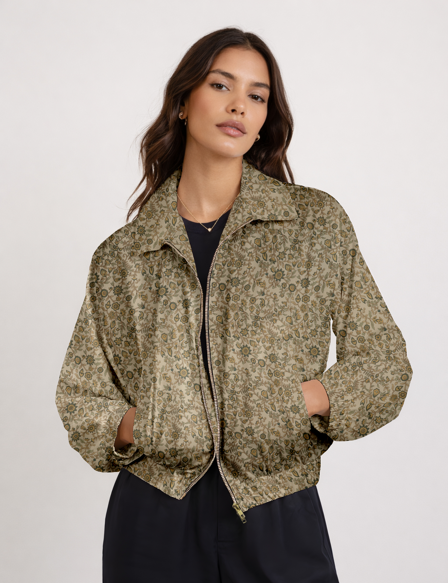 Women's cropped bomber jacket with twin metallic front zippers, welt pockets, elasticated hem and cuffs, and contrast sari print lining.