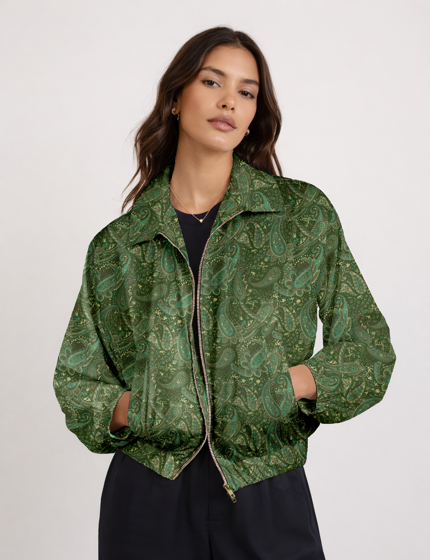 Women's cropped bomber jacket with twin metallic front zippers, welt pockets, elasticated hem and cuffs, and contrast sari print lining.