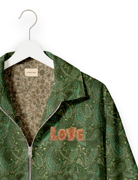 Love Bomber Jacket made from recycled fabric, featuring hand-stitched Aari embroidery. A unique piece of zero-waste clothing, part of the circular fashion movement. Designed with upcycled materials for a stylish yet environmentally friendly clothing choice.