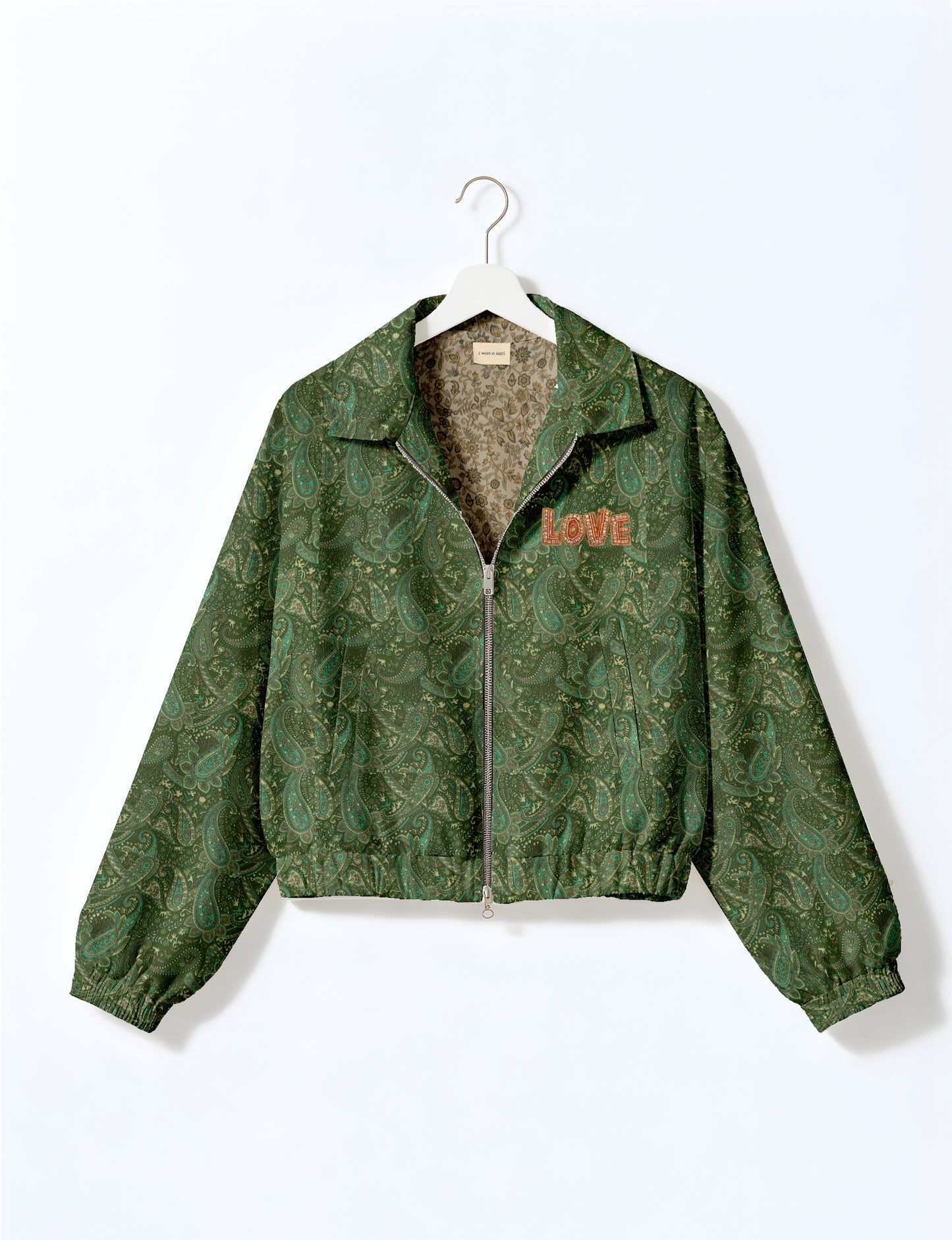 Love Bomber Jacket made from recycled fabric, featuring hand-stitched Aari embroidery. A unique piece of zero-waste clothing, part of the circular fashion movement. Designed with upcycled materials for a stylish yet environmentally friendly clothing choice.
