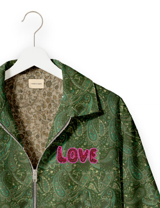 Love Bomber Jacket made from recycled fabric, featuring hand-stitched Aari embroidery. A unique piece of zero-waste clothing, part of the circular fashion movement. Designed with upcycled materials for a stylish yet environmentally friendly clothing choice.