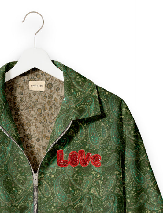 Love Bomber Jacket made from recycled fabric, featuring hand-stitched Aari embroidery. A unique piece of zero-waste clothing, part of the circular fashion movement. Designed with upcycled materials for a stylish yet environmentally friendly clothing choice.