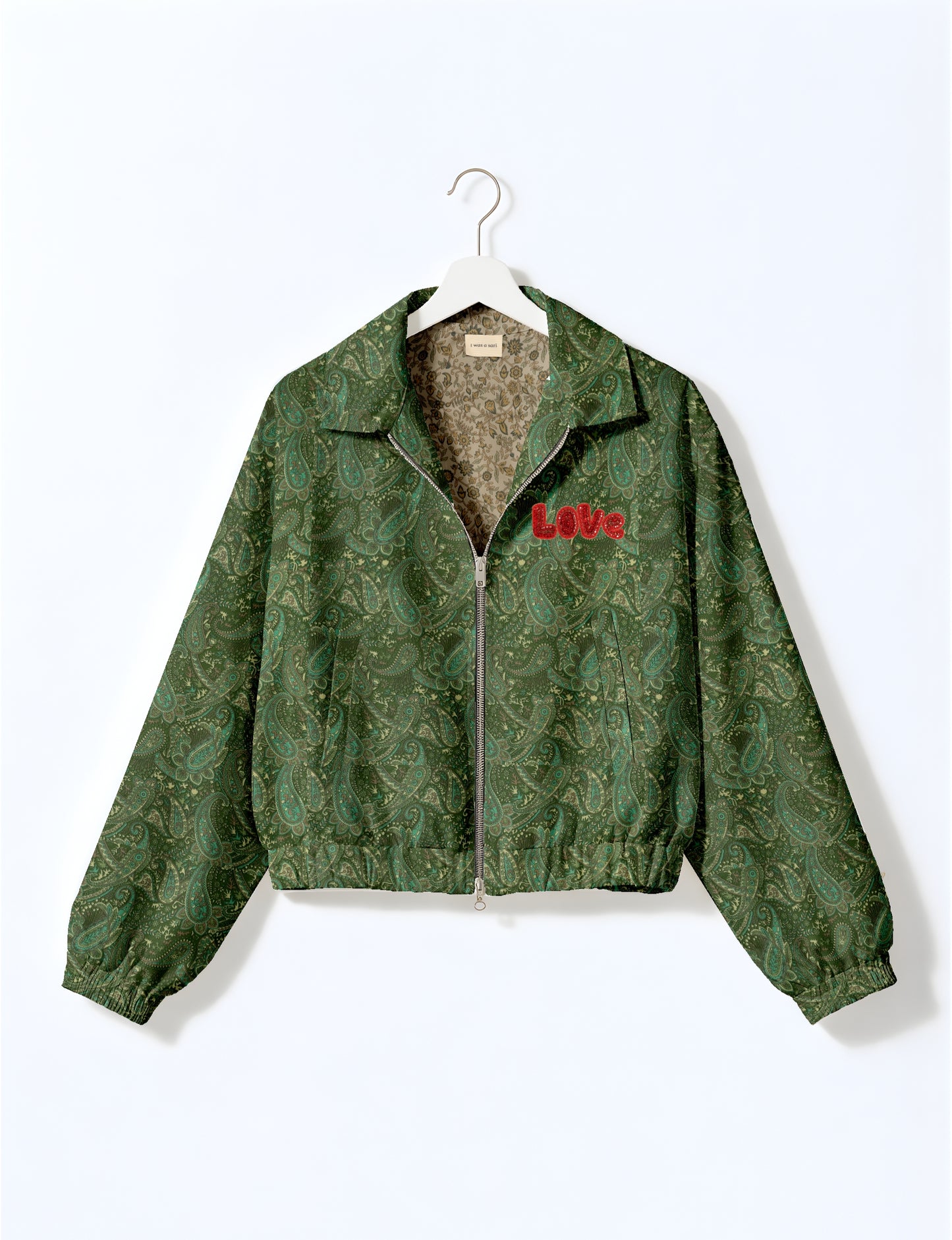 Love Bomber Jacket made from recycled fabric, featuring hand-stitched Aari embroidery. A unique piece of zero-waste clothing, part of the circular fashion movement. Designed with upcycled materials for a stylish yet environmentally friendly clothing choice.