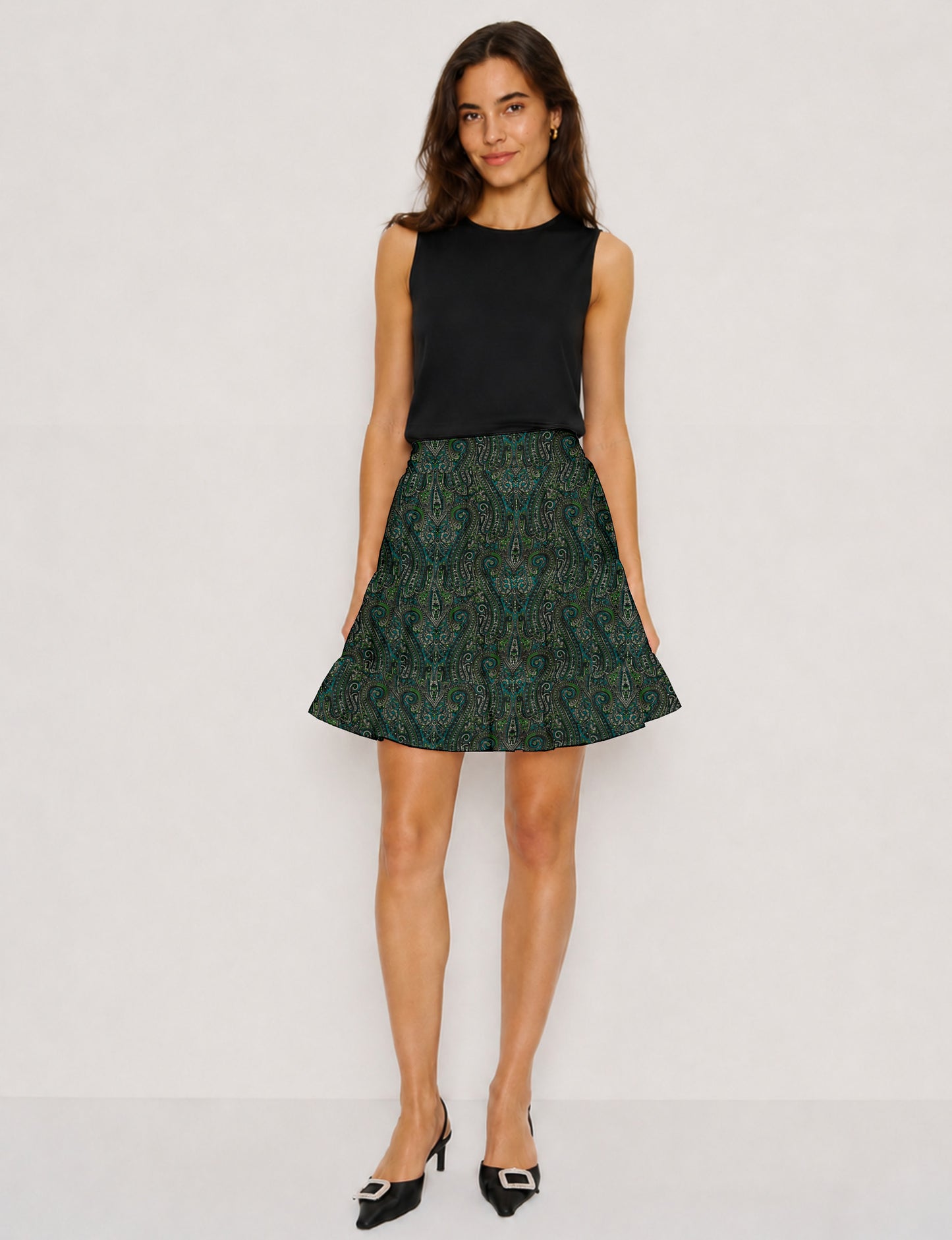 Short tiered skirt with a fitted waistband, knife pleats, softly flared silhouette, side seam pockets, and above-the-knee length.