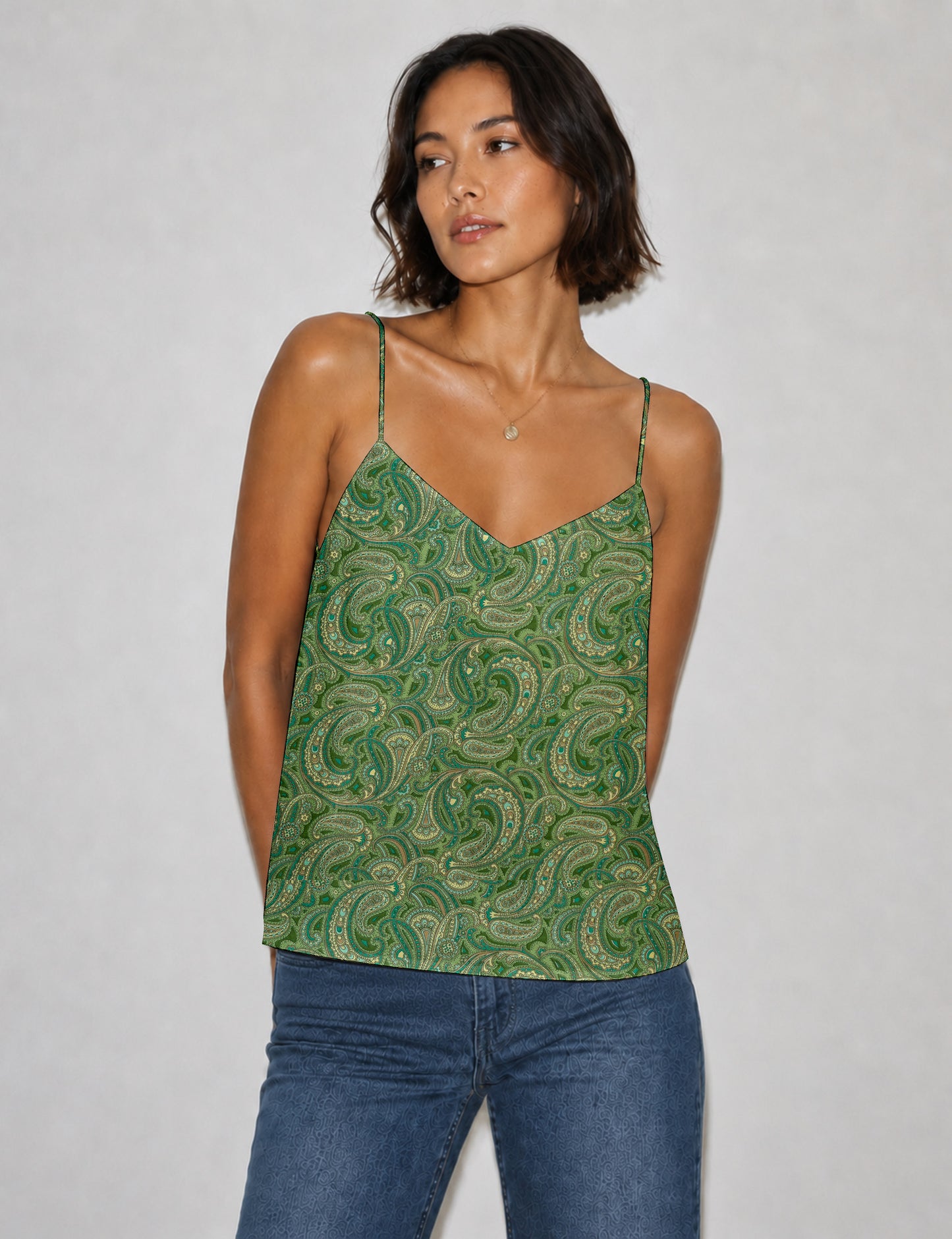 Women's sleeveless slip top with a relaxed straight fit, soft V-neckline, deep V-back, and delicate spaghetti straps.