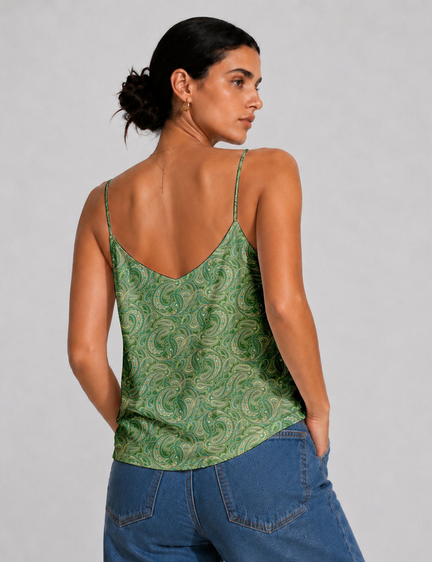 Women's sleeveless slip top with a relaxed straight fit, soft V-neckline, deep V-back, and delicate spaghetti straps.